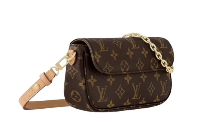 A Louis Vuitton monogram canvas shoulder bag with a chain strap and leather accents.