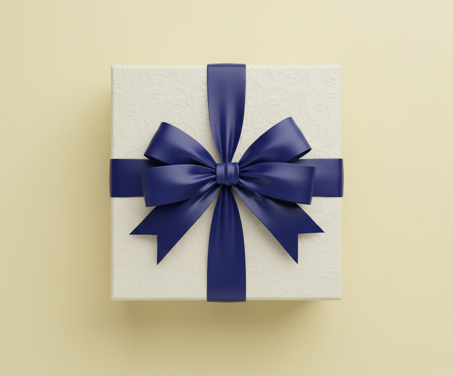 A white gift box wrapped with a large blue satin ribbon tied into a bow, on a pale yellow background.