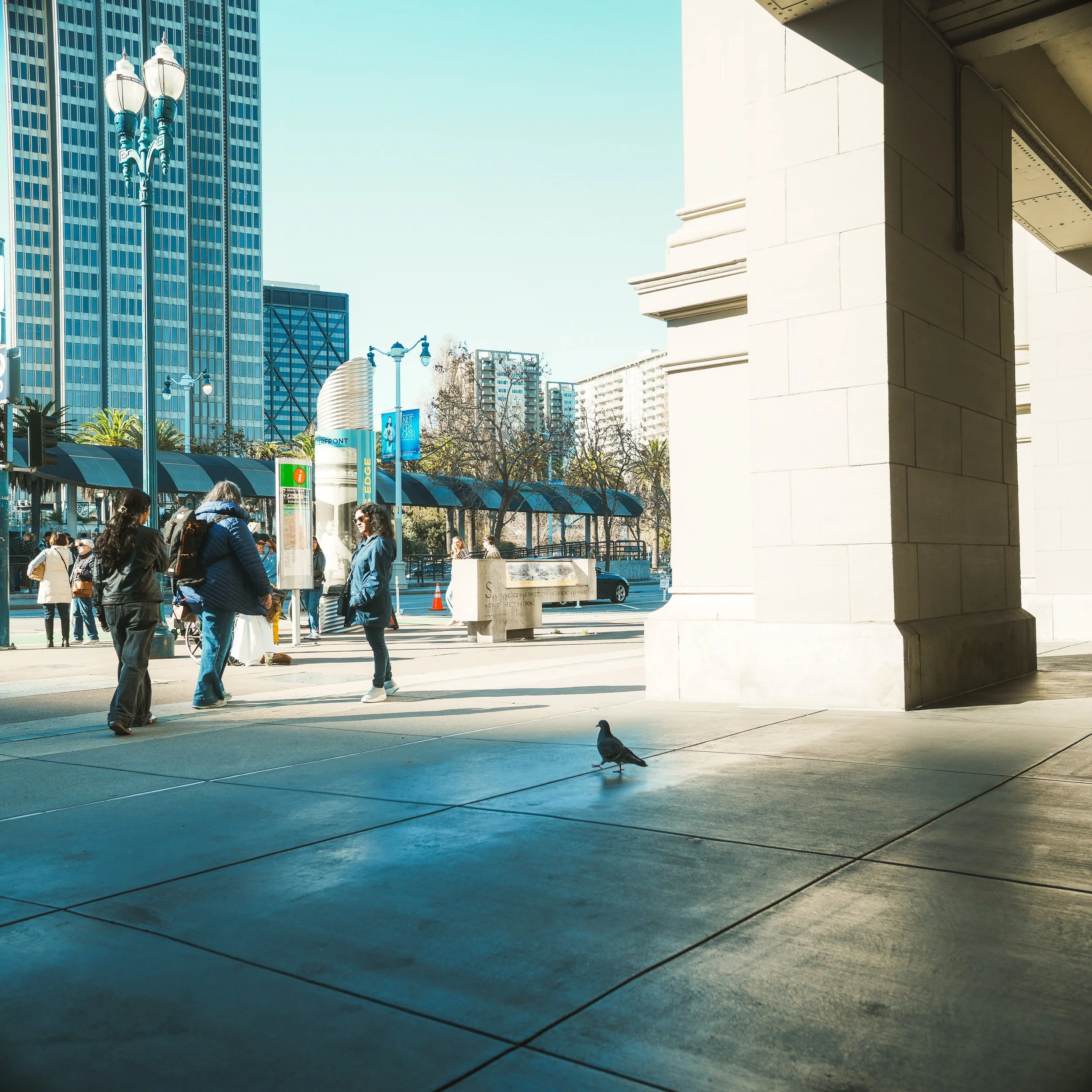 Wanderer in front of Ferry Building. Sony A7C II + 24mm f/1.8 ZA.