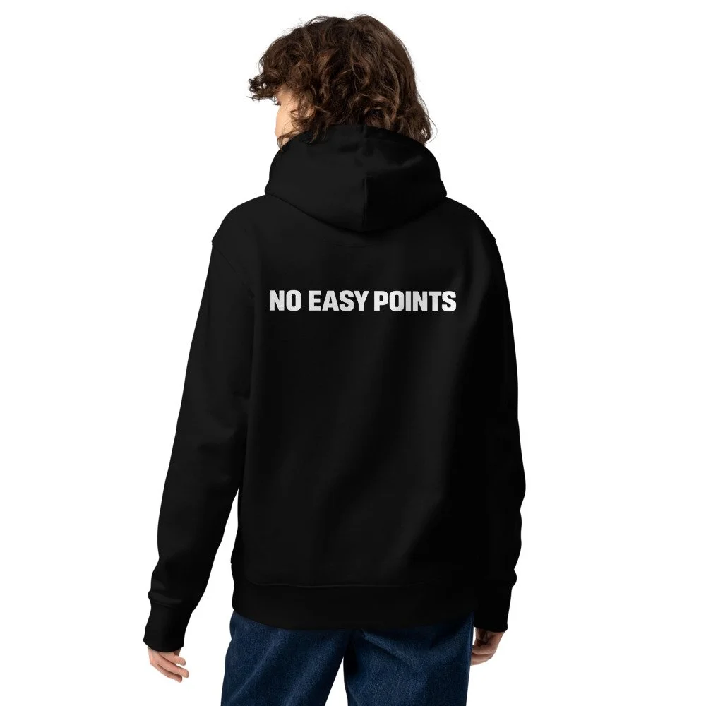 Back of a person wearing a black hoodie with the phrase "NO EASY POINTS" printed on the back in white letters.