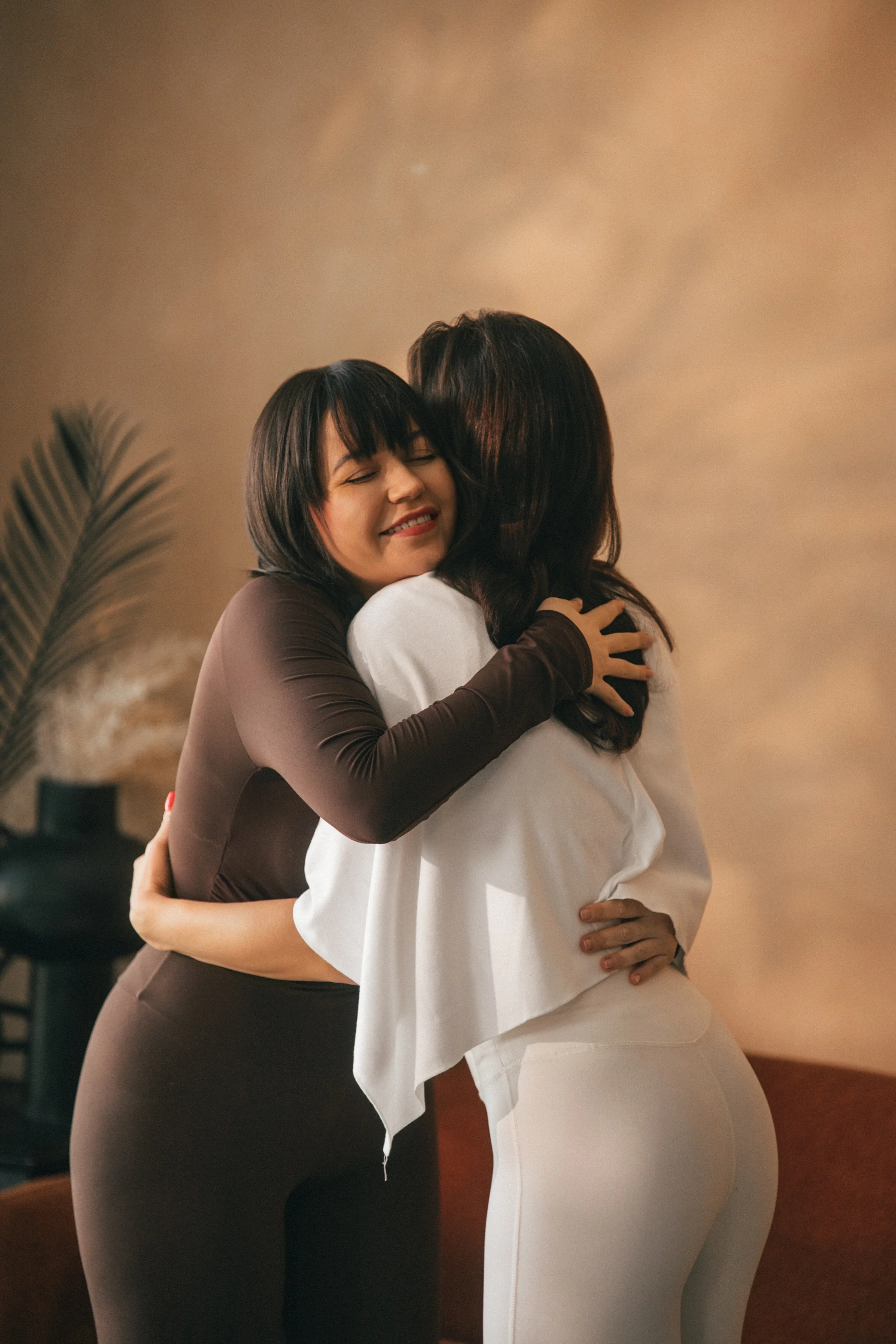 Vanessa Hartmann warmly hugging a client after a private sound healing or somatic breathwork session, creating a safe space for emotional support and nervous system regulation in Dubai.