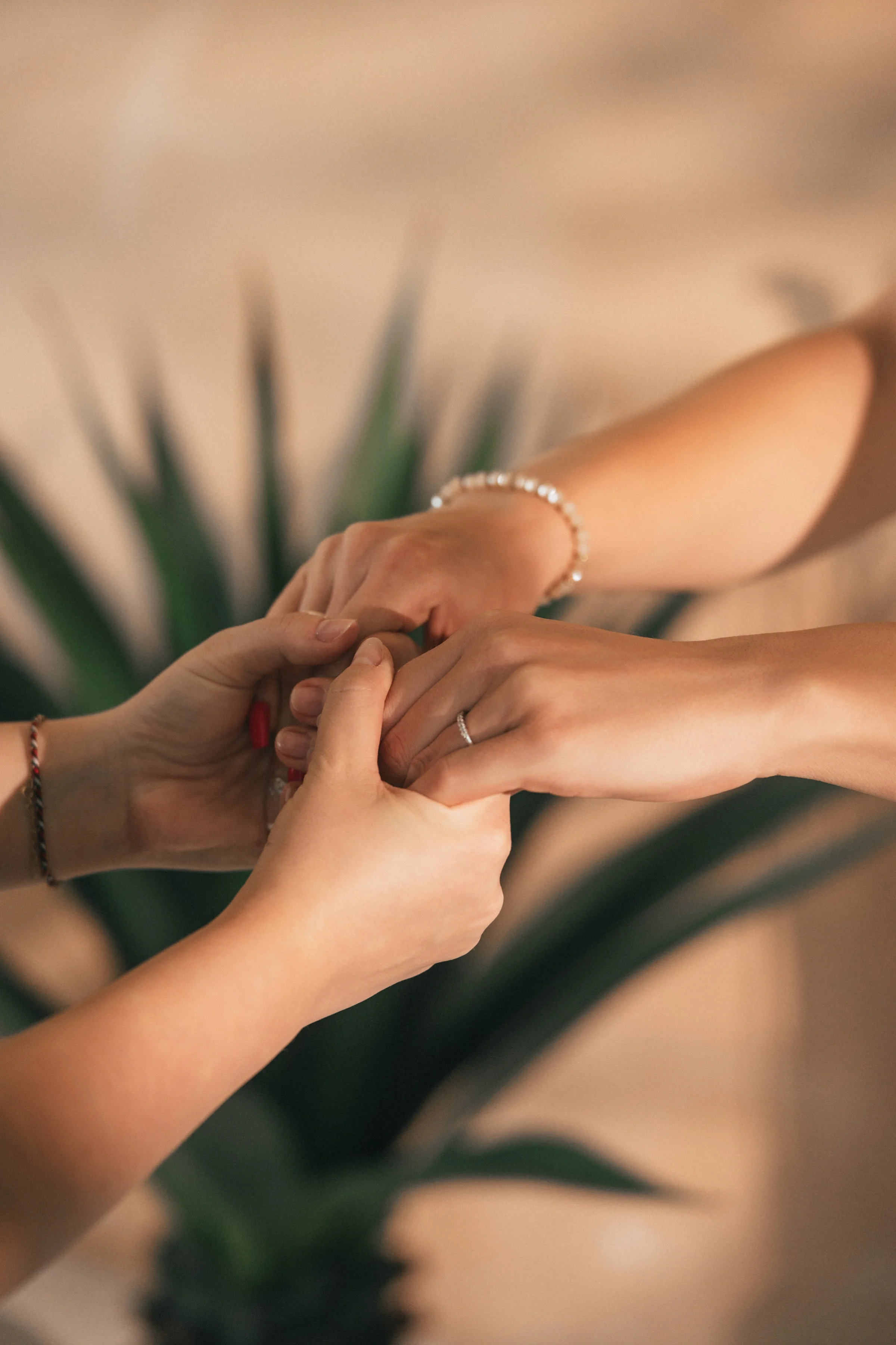 Vanessa Hartmann holding a client’s hands in a safe and supportive way during a trauma-informed somatic breathwork session for nervous system regulation in Dubai.