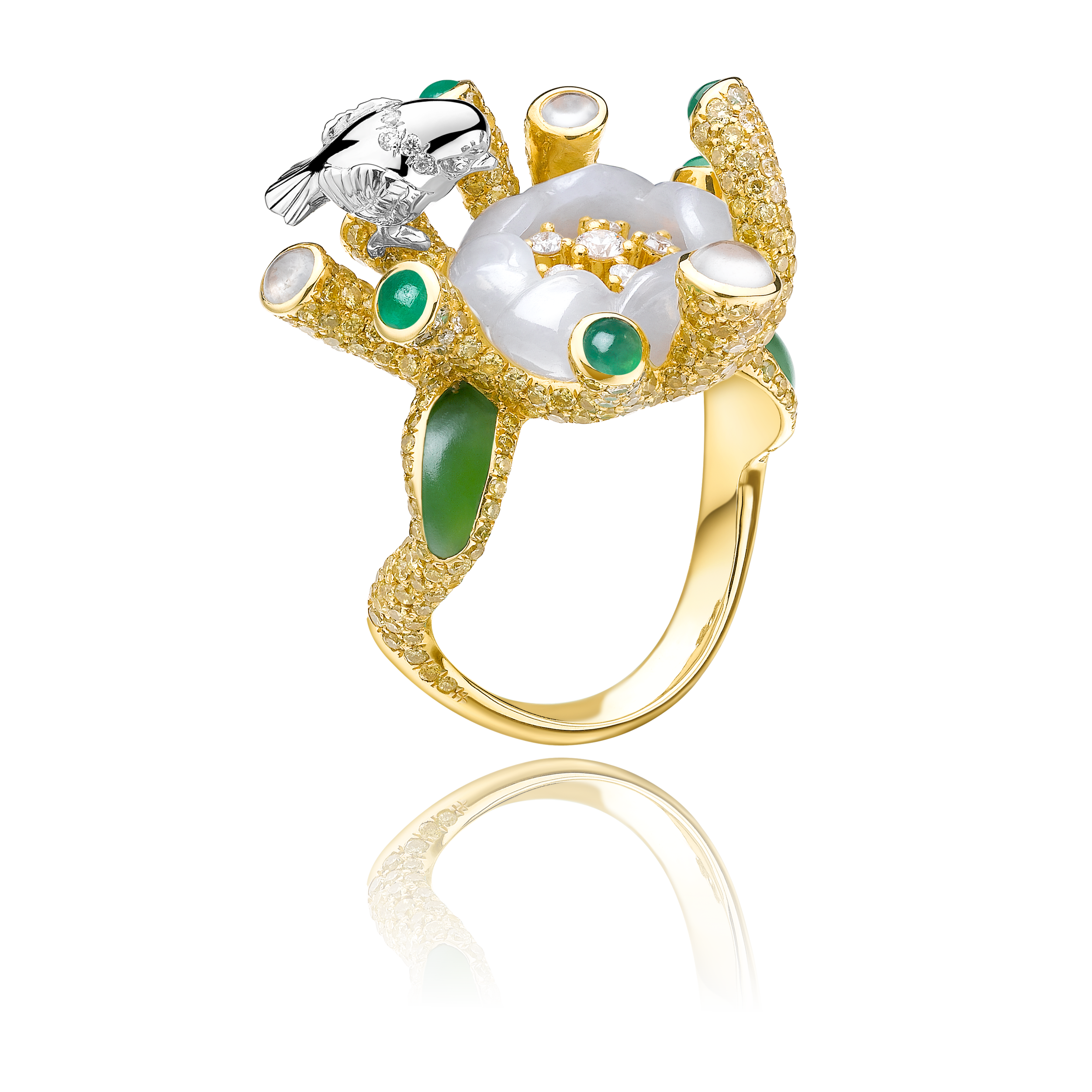 A gold ring shaped like an exquisite flower, adorned with green and white Hetian jade accents, set with various gemstones, and featuring a silver bird perched on its side.