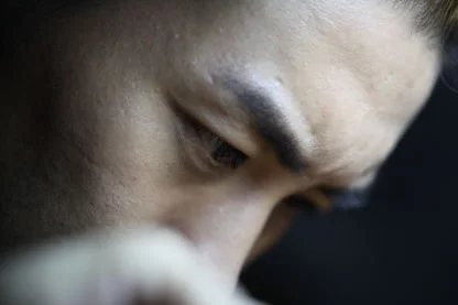 Close-up of a person's eye and part of their forehead