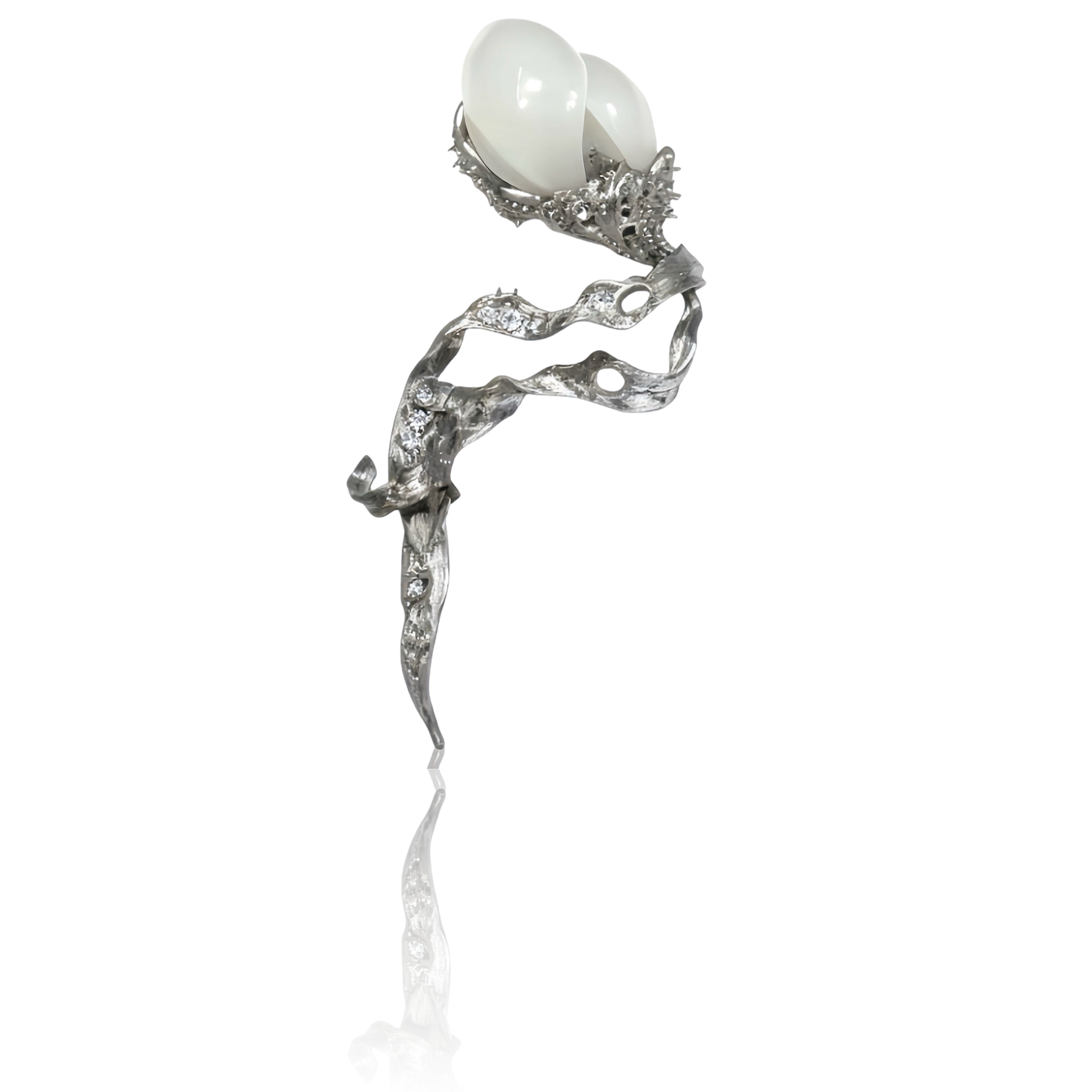 Constructing a philosophical field through the opposing imagery of "flower and sword." The entire piece is crafted from titanium, with a five-petal flower carved from Hetian white jade suspended above a sword-shaped leaf forged from titanium.