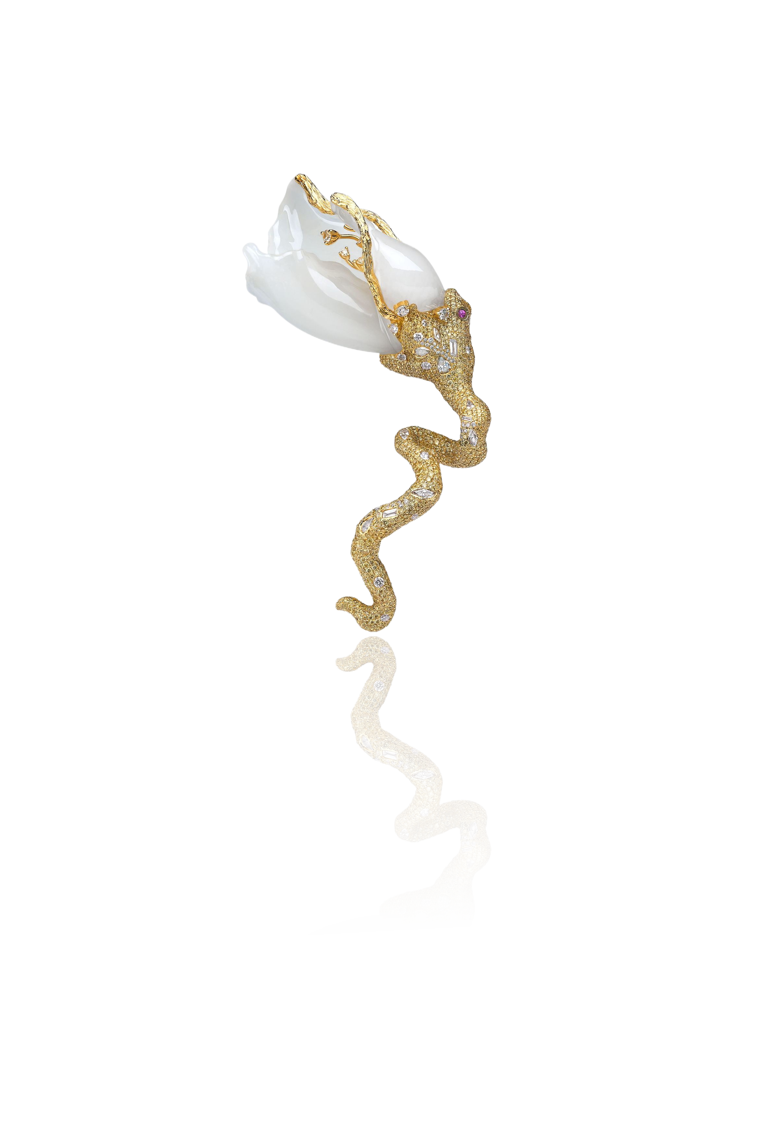 A gold jewelry piece designed as a snake with embedded diamonds, holding a large white pearl in its mouth.