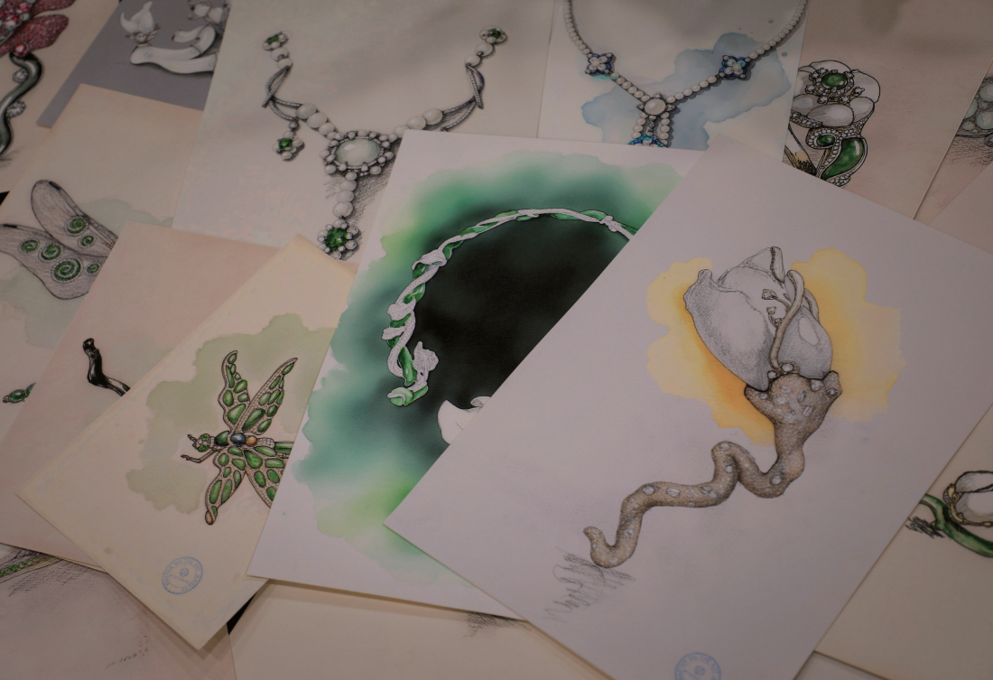 Collection of jewelry sketches and watercolor illustrations of necklaces, butterflies.