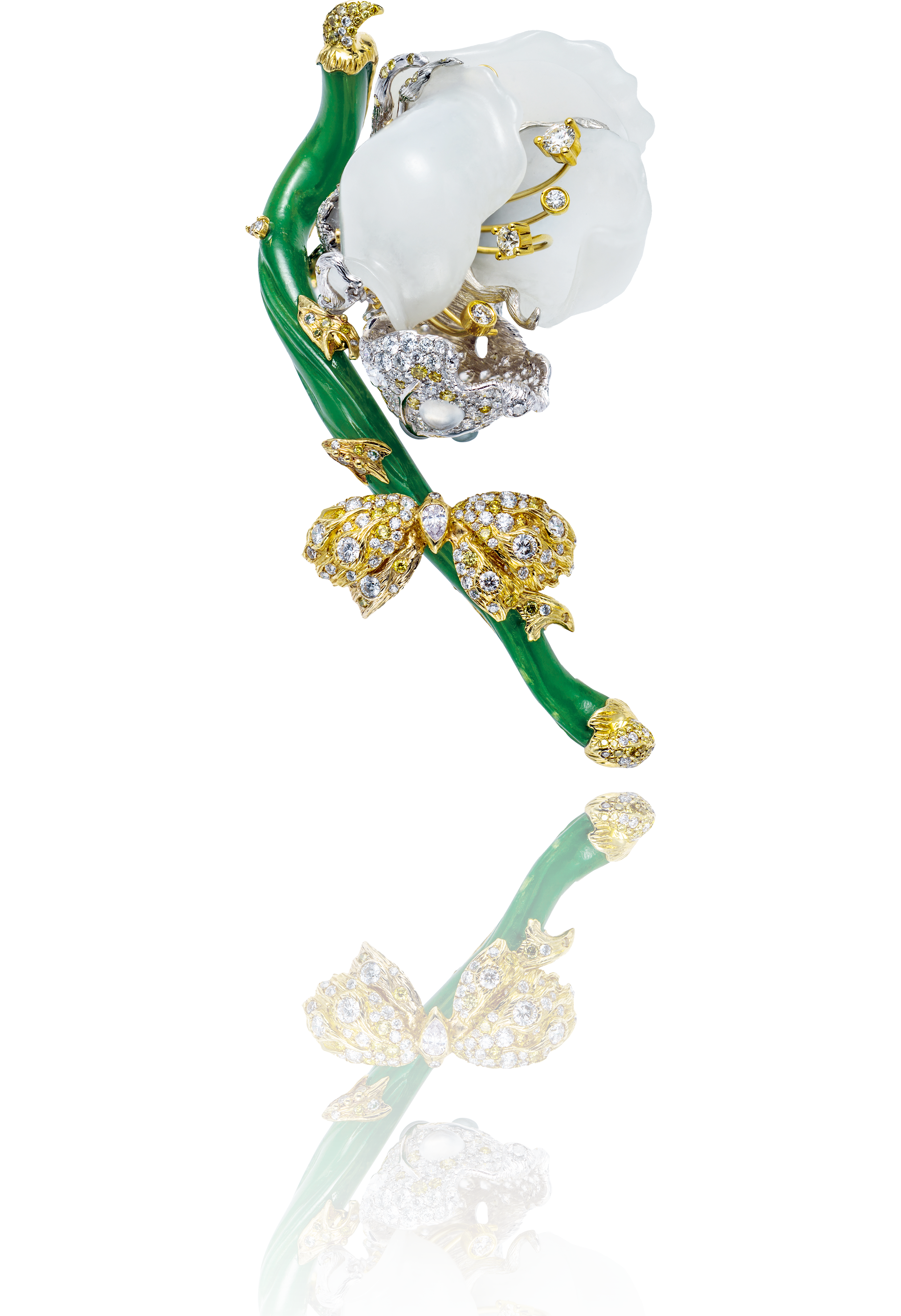 Jewelry brooch designed as a white flower with a green stem, adorned with gold, diamonds, and pearl accents, reflected on a shiny surface.