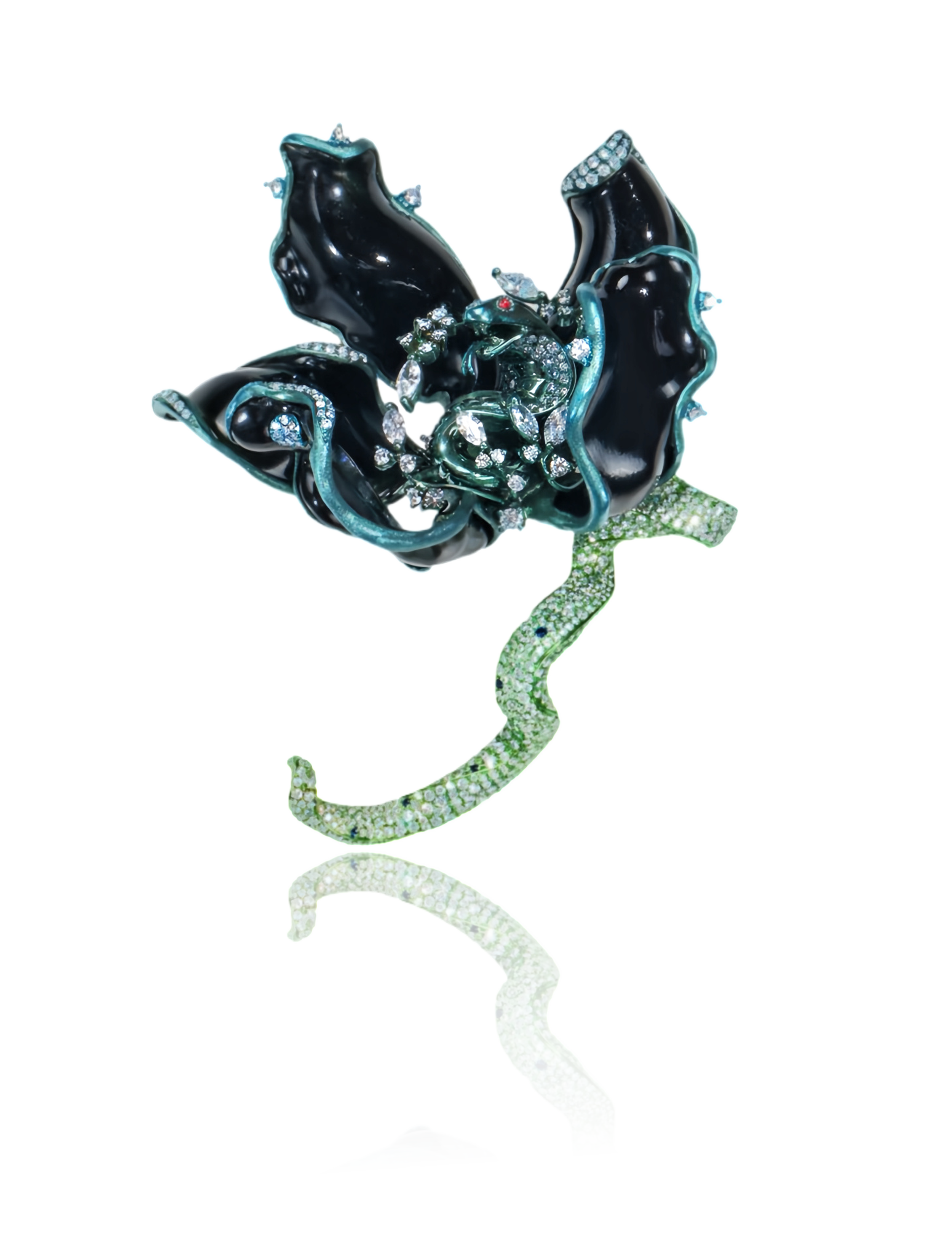 A black floral brooch in the shape of a dahlia carved from jade. Upon closer inspection, the pistil is revealed to be a cobra, set with small diamonds.