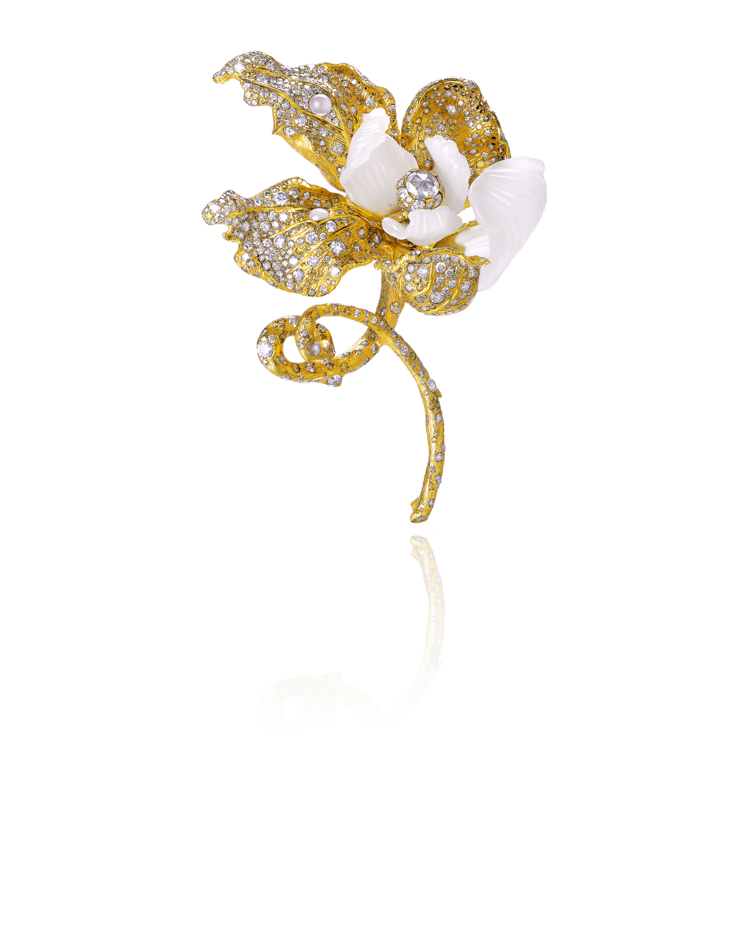 A decorative brooch in the shape of a flower with gold, diamonds, and white enamel accents, featuring a detailed gold stem and vibrant petal designs.