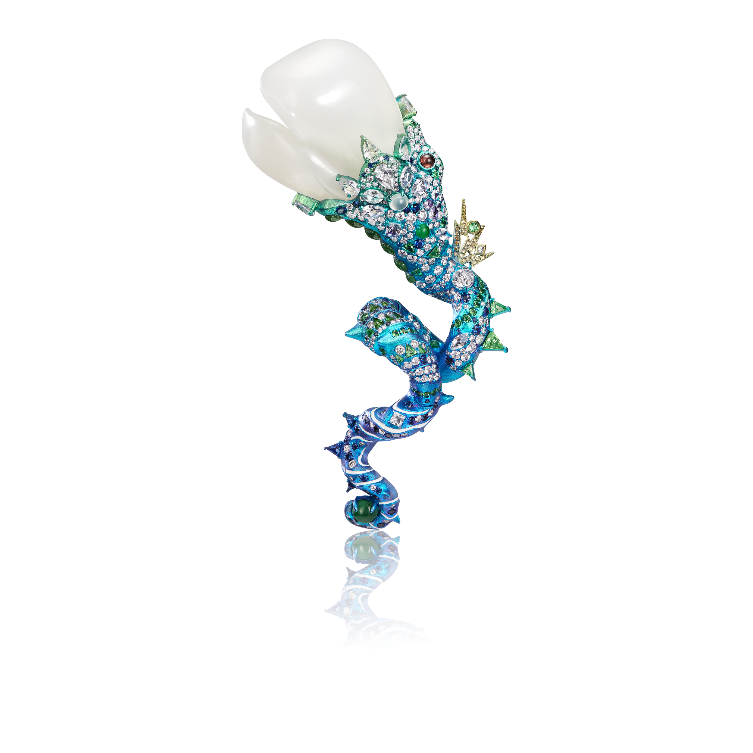 A light blue, multicolored serpent-shaped brooch, intricately designed and adorned with blue, green, and white gemstones, accented with white Hetian jade at the top.