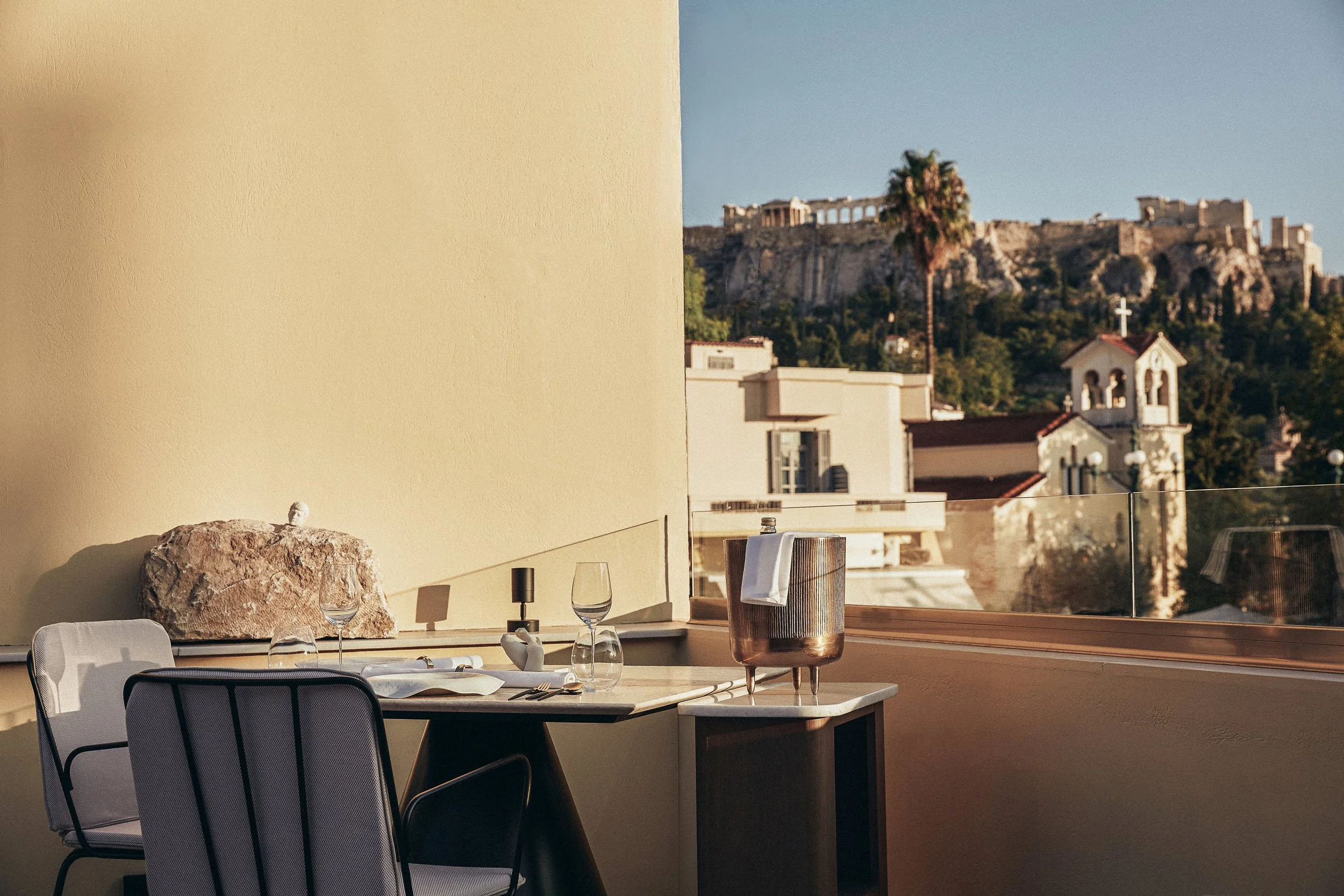 A table on the terrace at Makris Restaurant, Athens, with a view of the Parthenon in the background