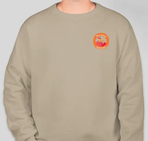 Beige sweatshirt with a logo on the chest that reads 'Nice Mamas Nonprofit' and features a cartoon illustration of two women with a child.