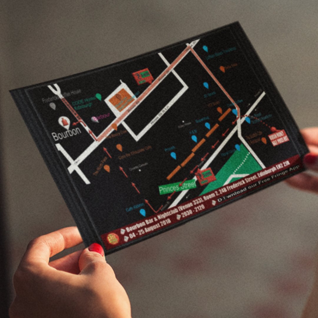 Person holding a colorful map or event guide showing streets, locations, and a route, with text for a nightlife venue and dates.