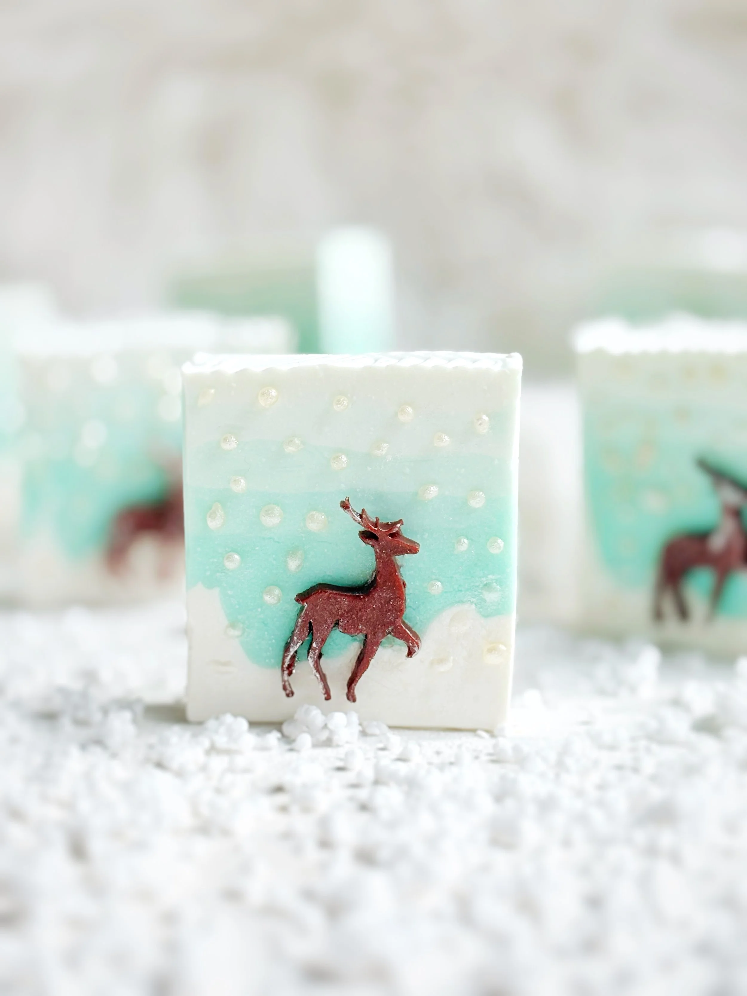 Decorative soap with a reindeer on a winter-themed background