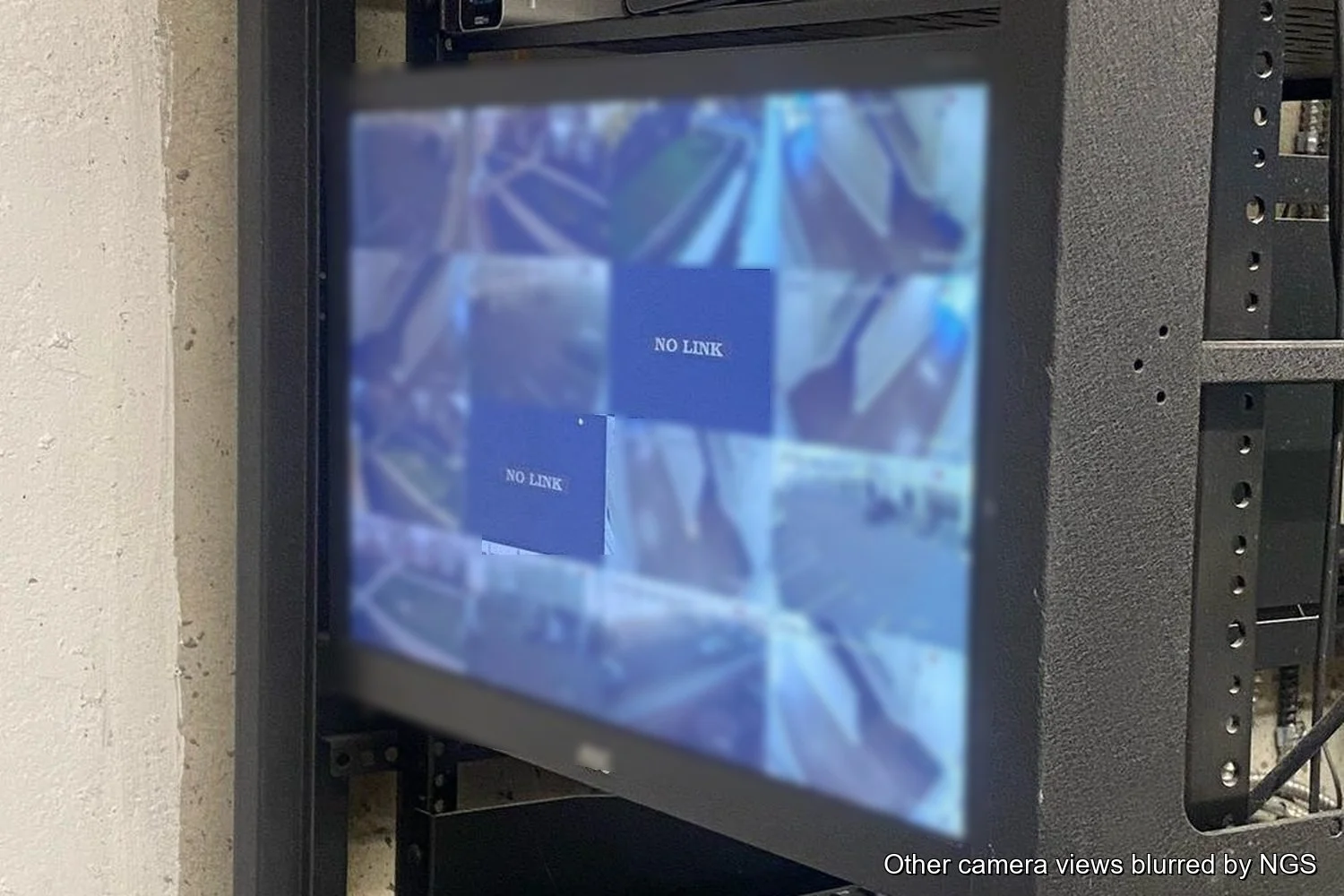 Security recorder screen with two feeds reading NO LINK. The other camera views are blurred.