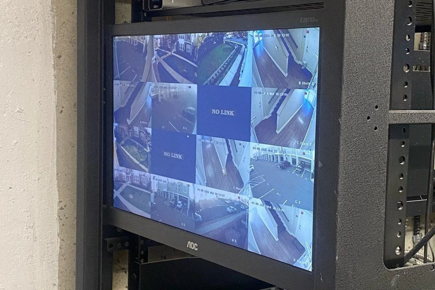 Security recorder screen showing a nine-camera grid with two feeds reading NO LINK