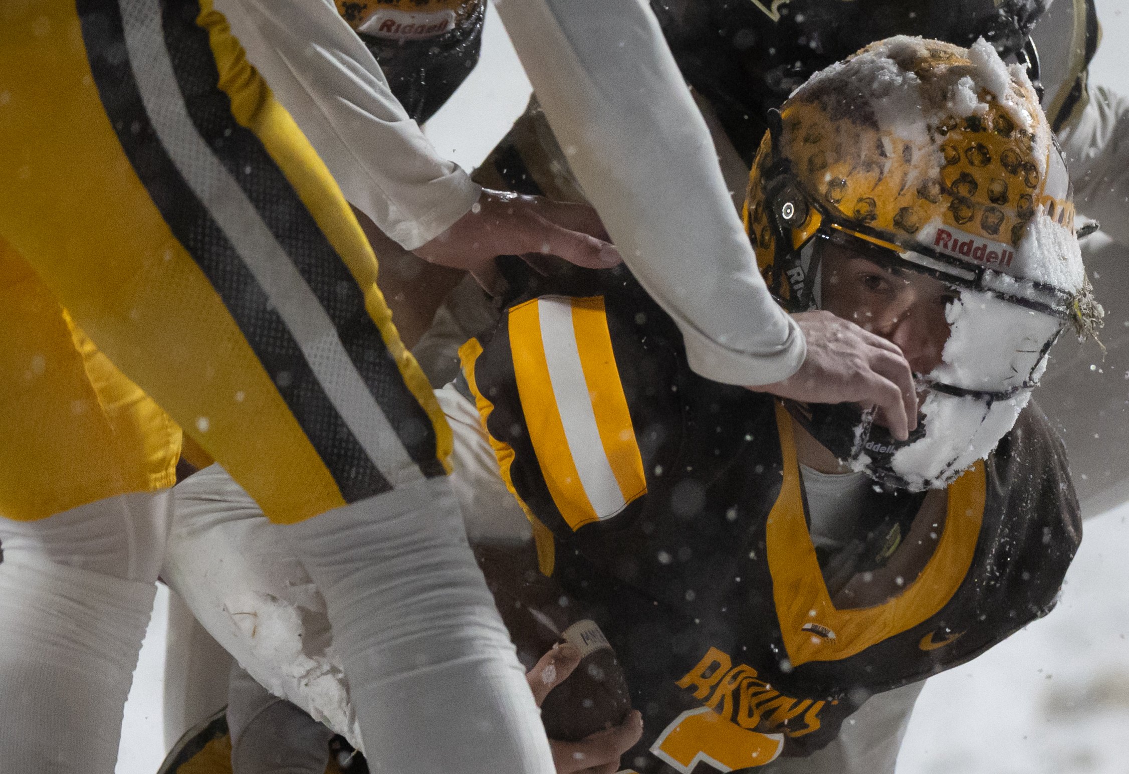 Helena Capital senior quarterback Merek Mihelish showcases a facemask full of snow during the Bruins' 35-6 victory over Billings West on Friday, Nov. 15, 2024, in the Class AA football semifinals.