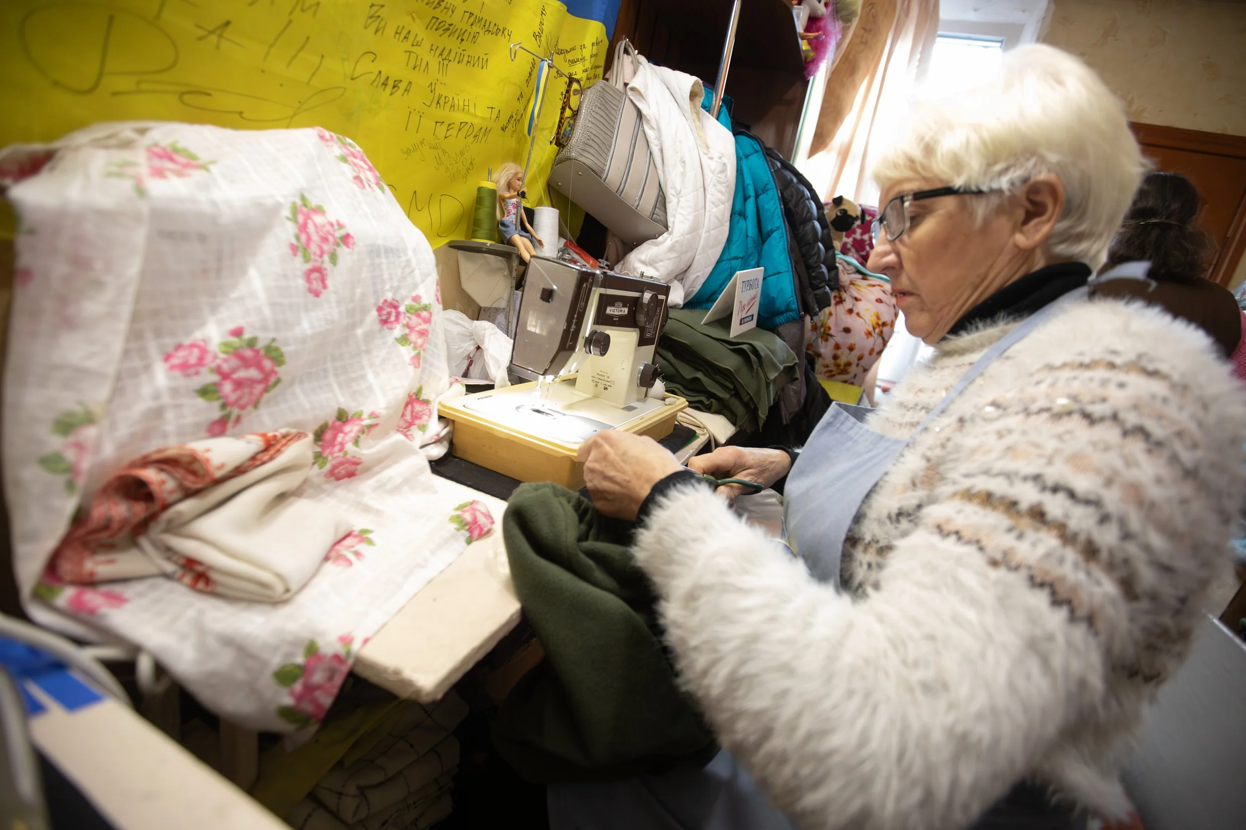 A Babushka Battalion member sews a fleece shirt Nov. 25, 2025, in Zhytomyr, Ukraine.