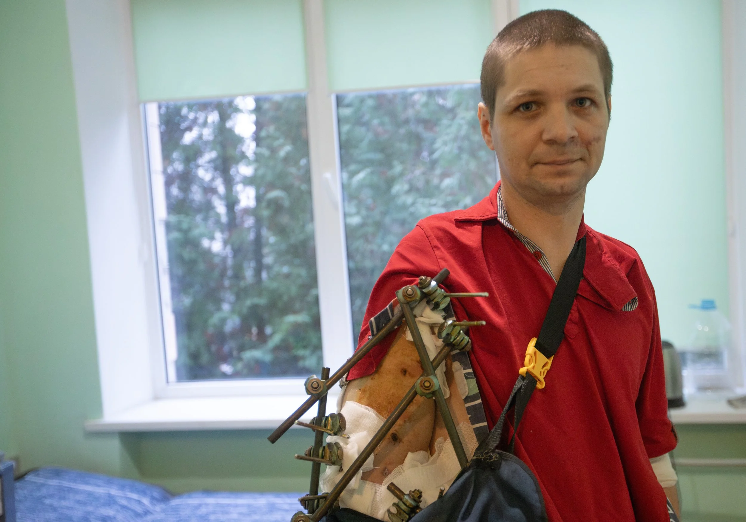 Roman, a Ukrainian soldier injured on the front lines, poses for a portrait inside his hospital room at the Zhytomyr Regional Clinical Hospital on Nov. 23, 2025.