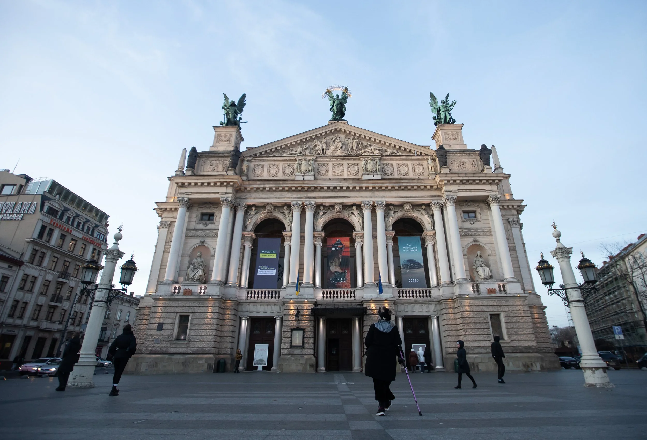 Hands On Global Executive Director Valerie Hellermann, center, walks toward the Solomiya Krushelnytska Lviv State Academic Theatre of Opera and Ballet house Nov. 19, 2025 in Lviv, Ukraine.