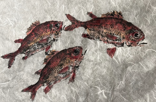 Three realistic, small fish with red and black coloration on a textured background.