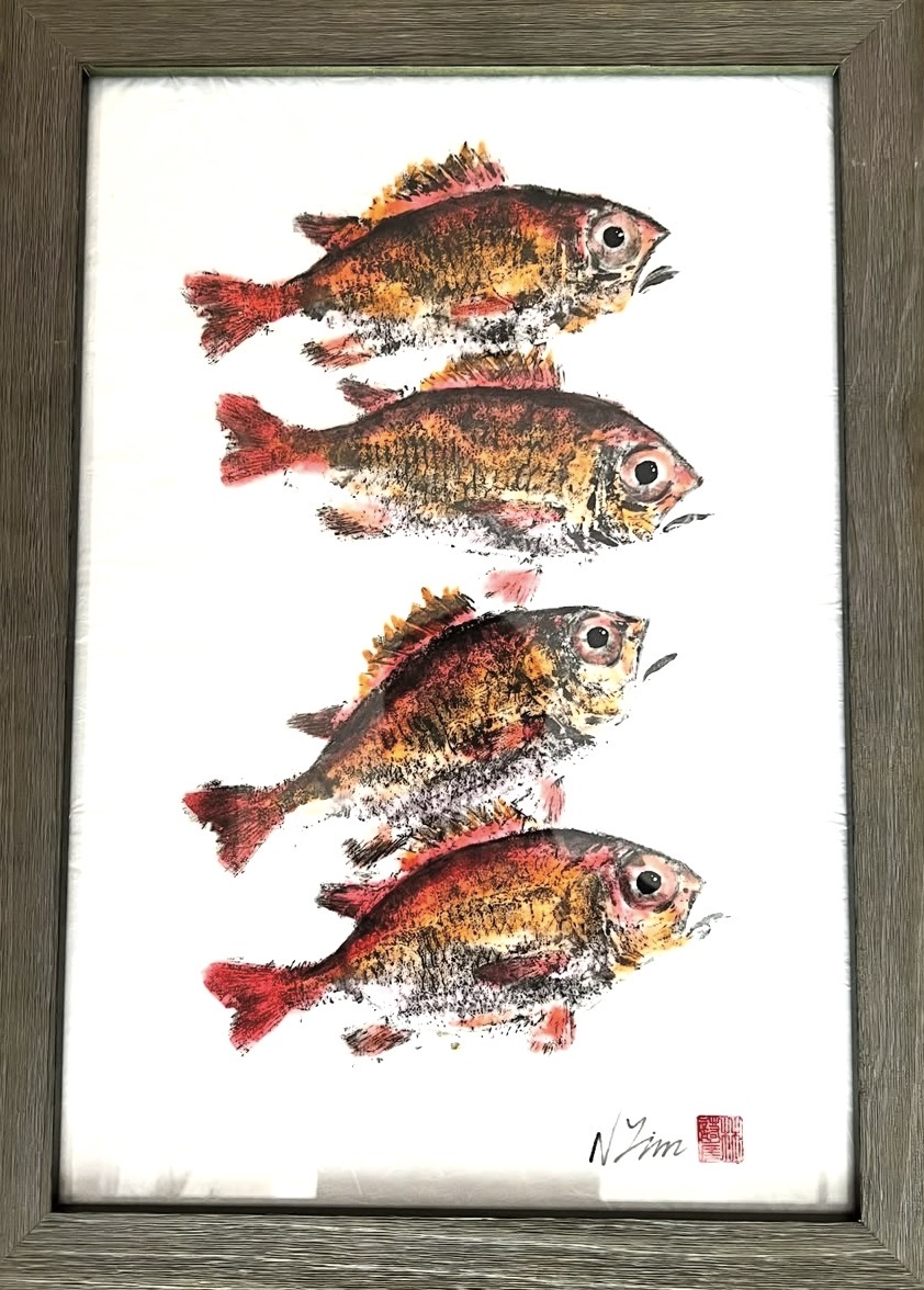 Painting of four colorful fish swimming in a vertical line, framed in wood.