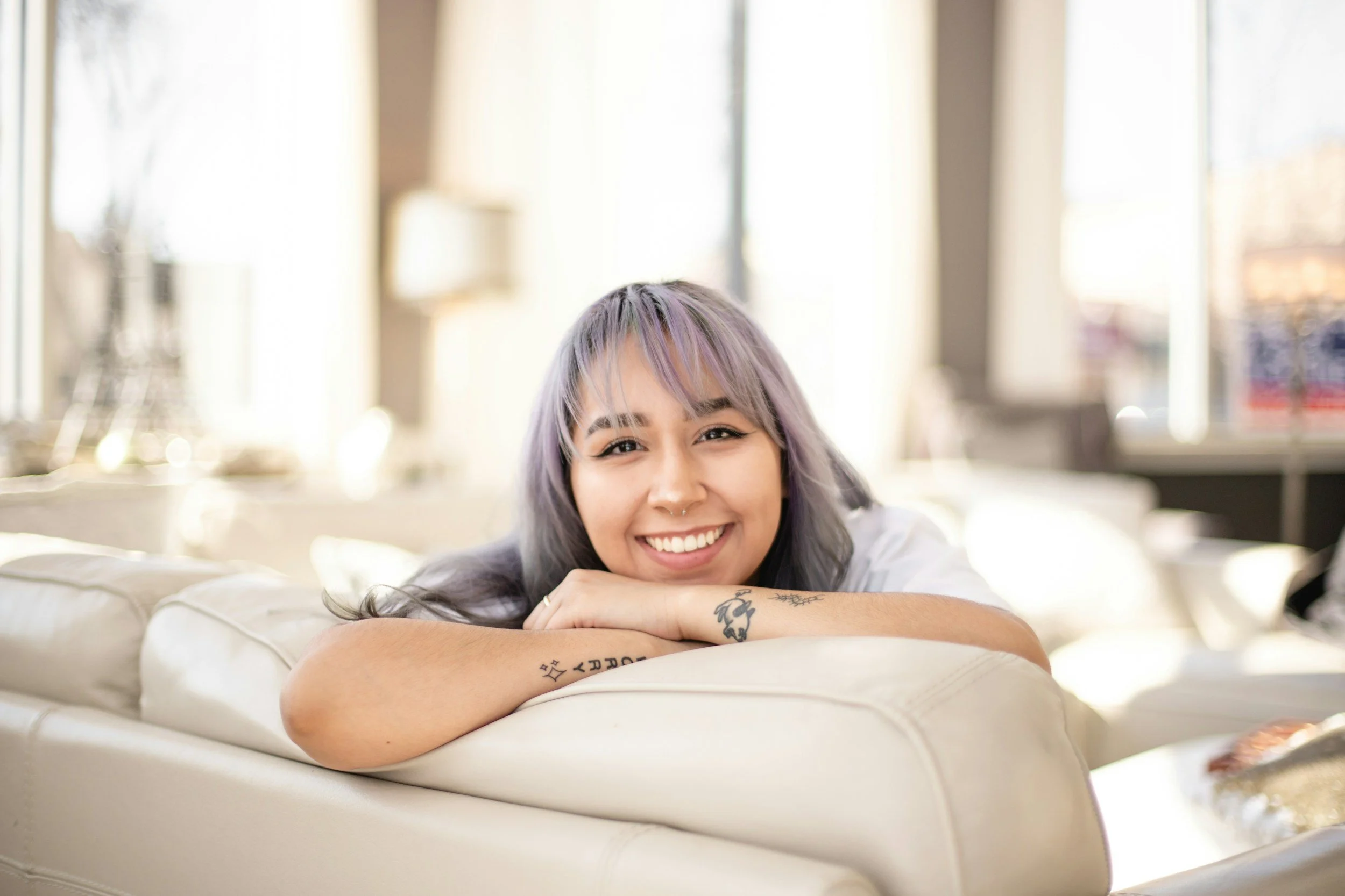 Smiling woman with purple hair