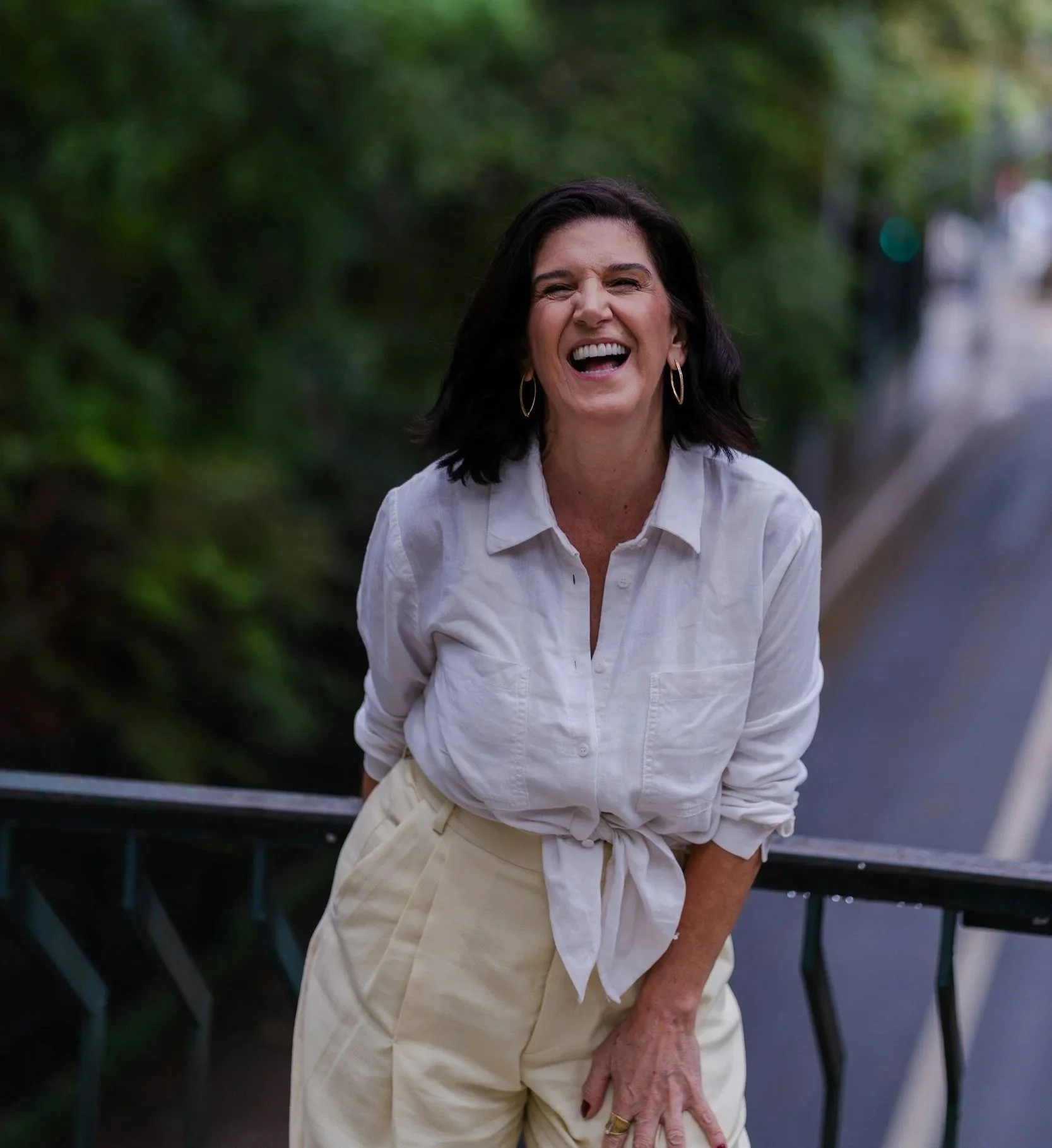 Smiling woman in white shirt
