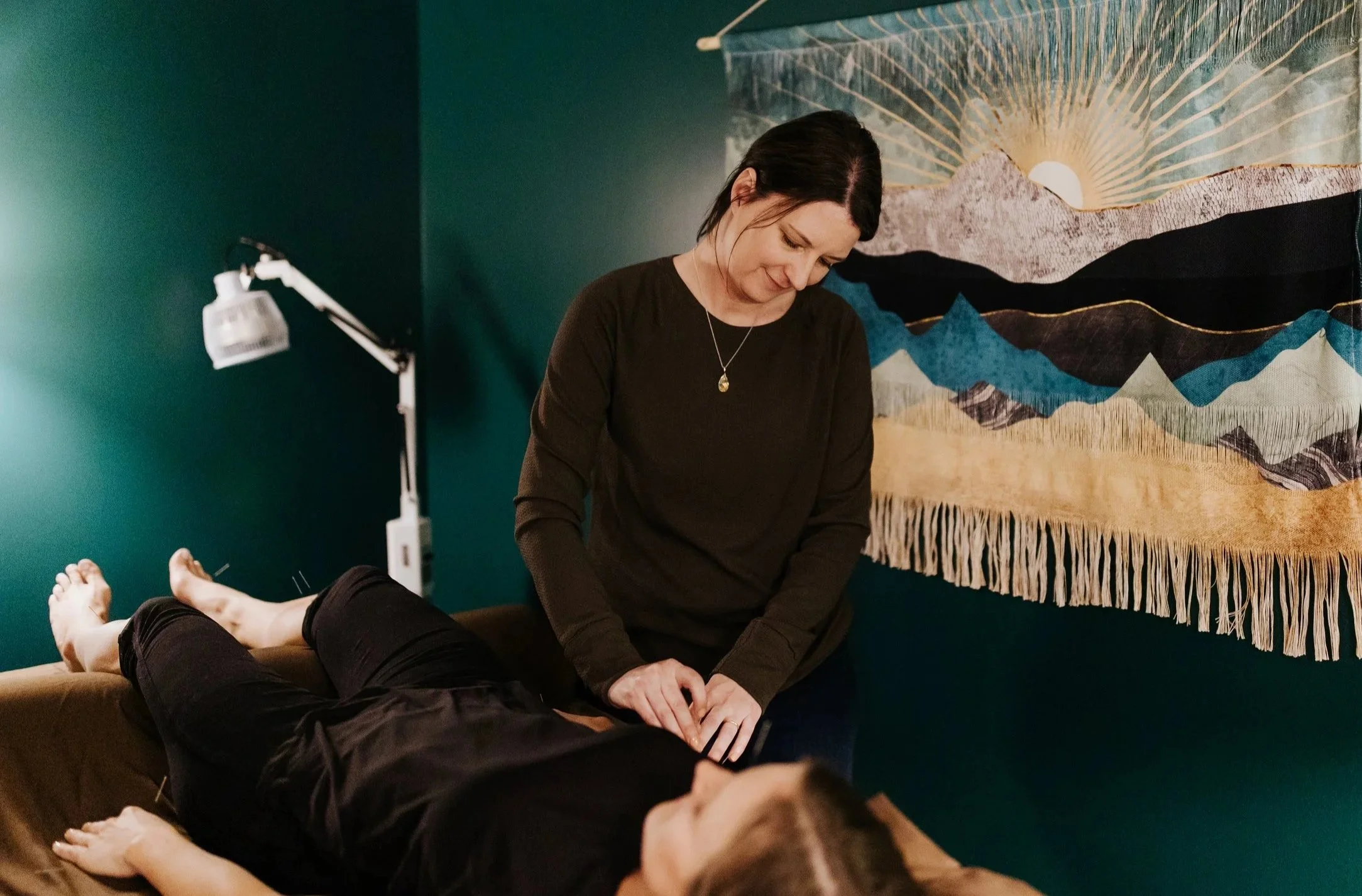 Photograph of Dr. Jean-Marie Cartier inserting needles in a patients right arm.