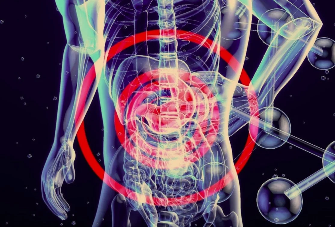 An illustration of a see-through skeleton with red bulls eye around the stomach