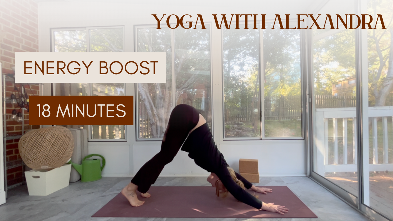 A woman practicing yoga in a sunlit room, in an A-frame yoga pose on a yoga mat with text overlay for yoga class titled 'Energy Boost', lasting 18 minutes, with the instructor's name 'Alexandra'.