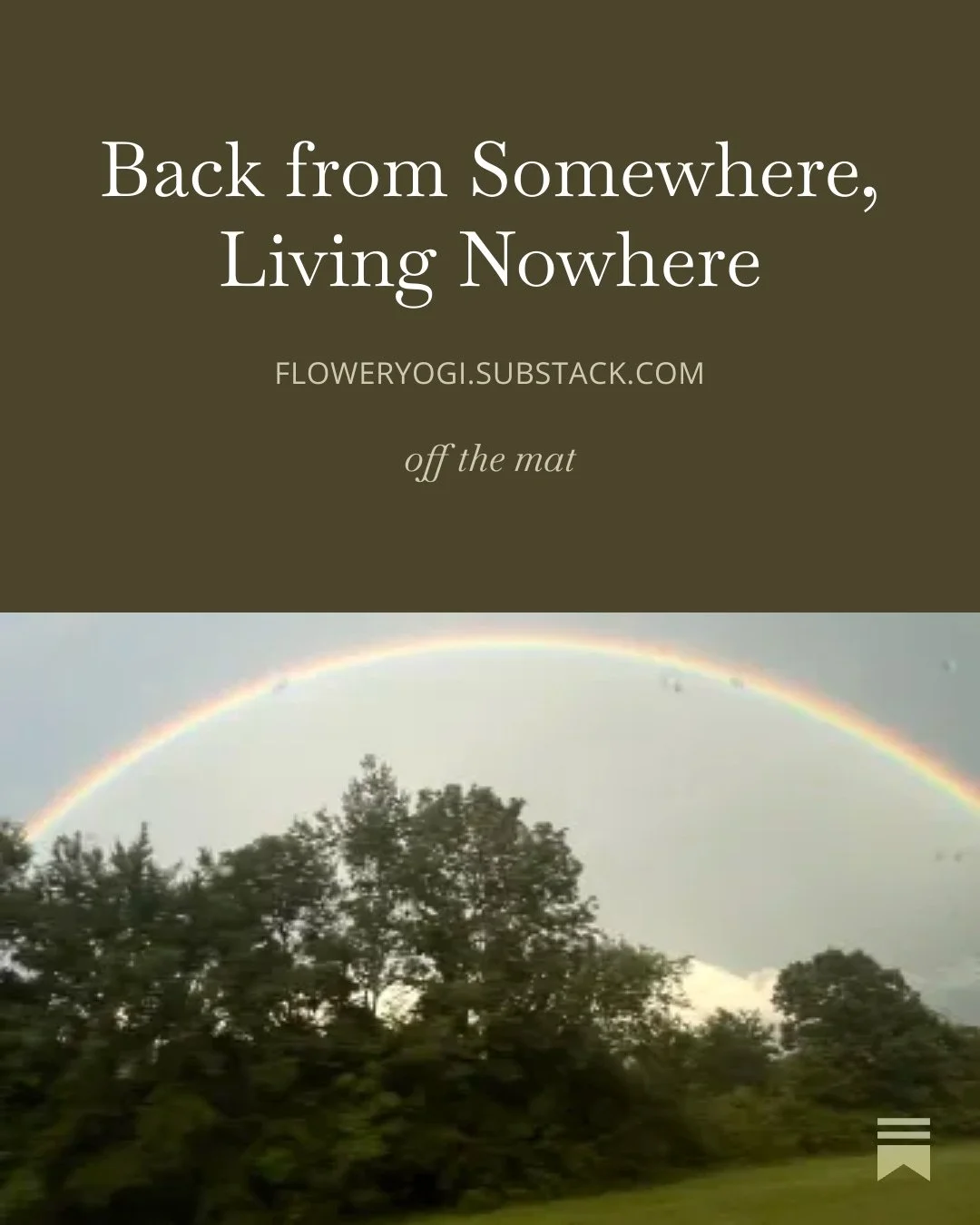 A rainbow arching over trees in a cloudy sky.