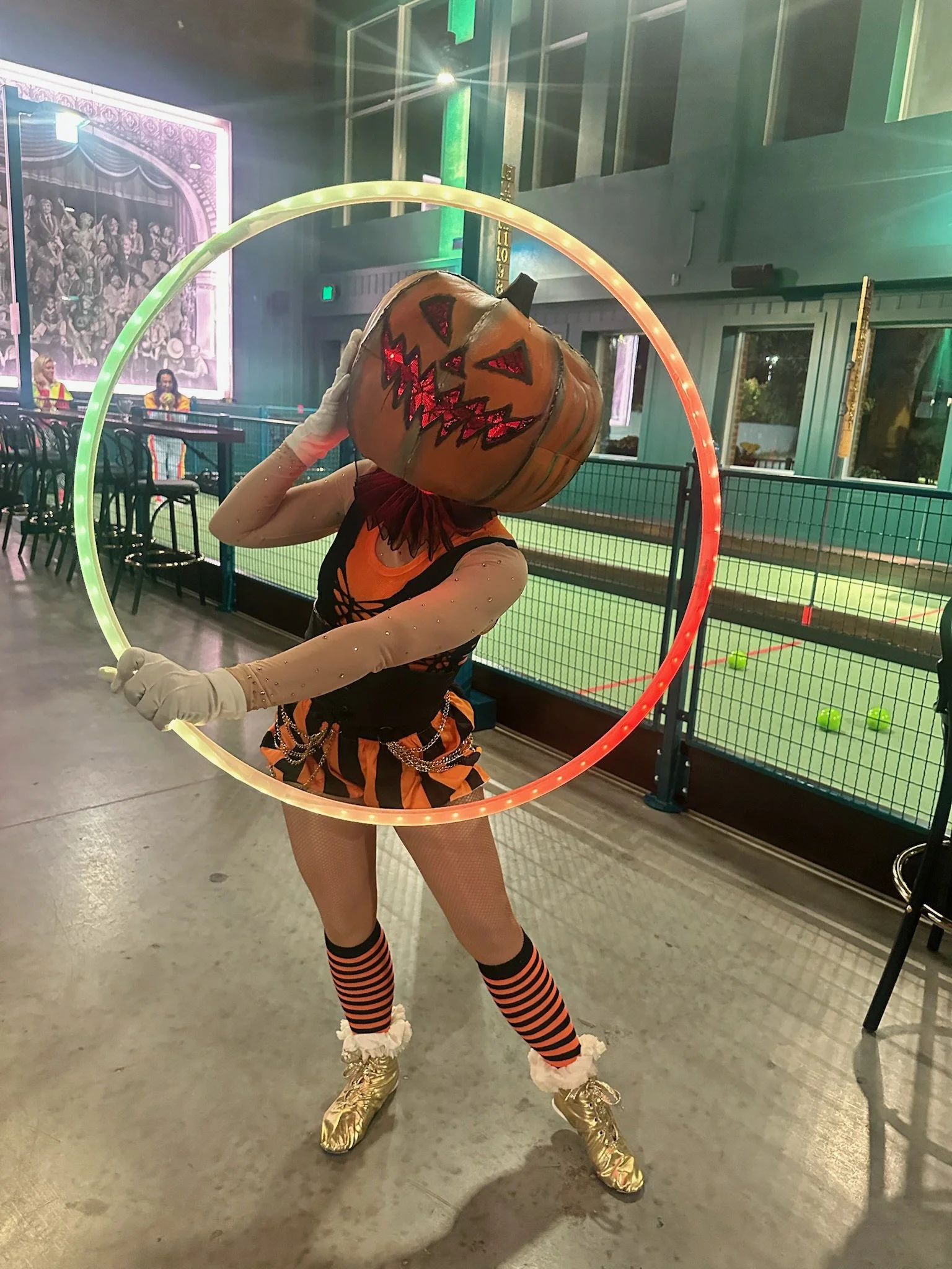 Halloween unique chracter hula hope head of jacklantern woman performer Spaces Performance Arts for Hire