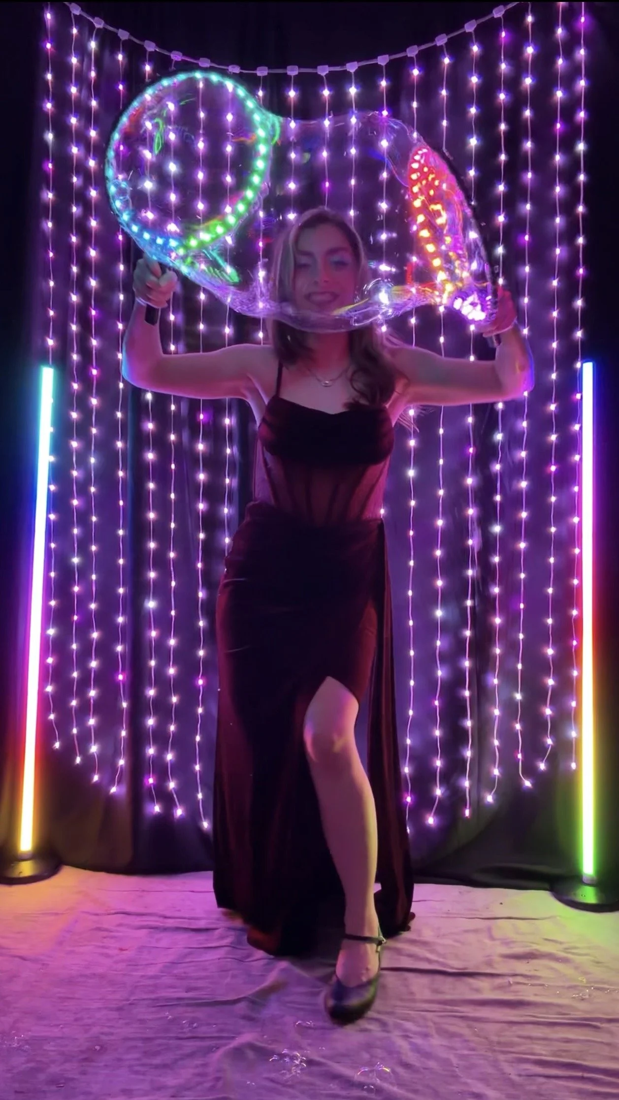 Pretty bubble performer LED lights wands and wall for hire