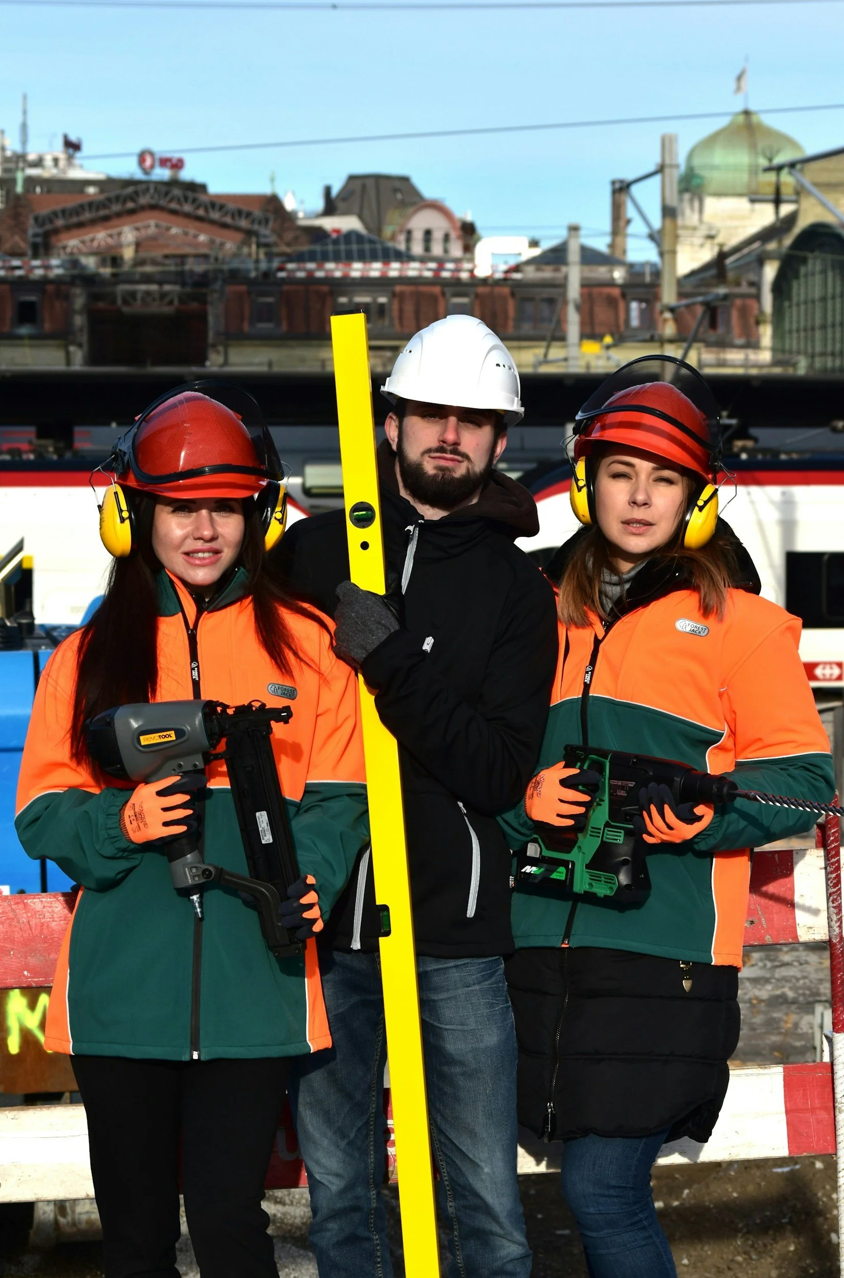Three construction workers who should be wearing hard hat HELP helmet emergency lifesaving profile medical safety stickers on their helmets.