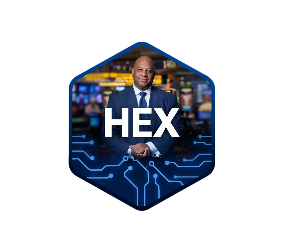 A professionally dressed man stands in front of a background with slot machines, with the word 'HEX' prominently displayed on the image, over a digital circuit design.