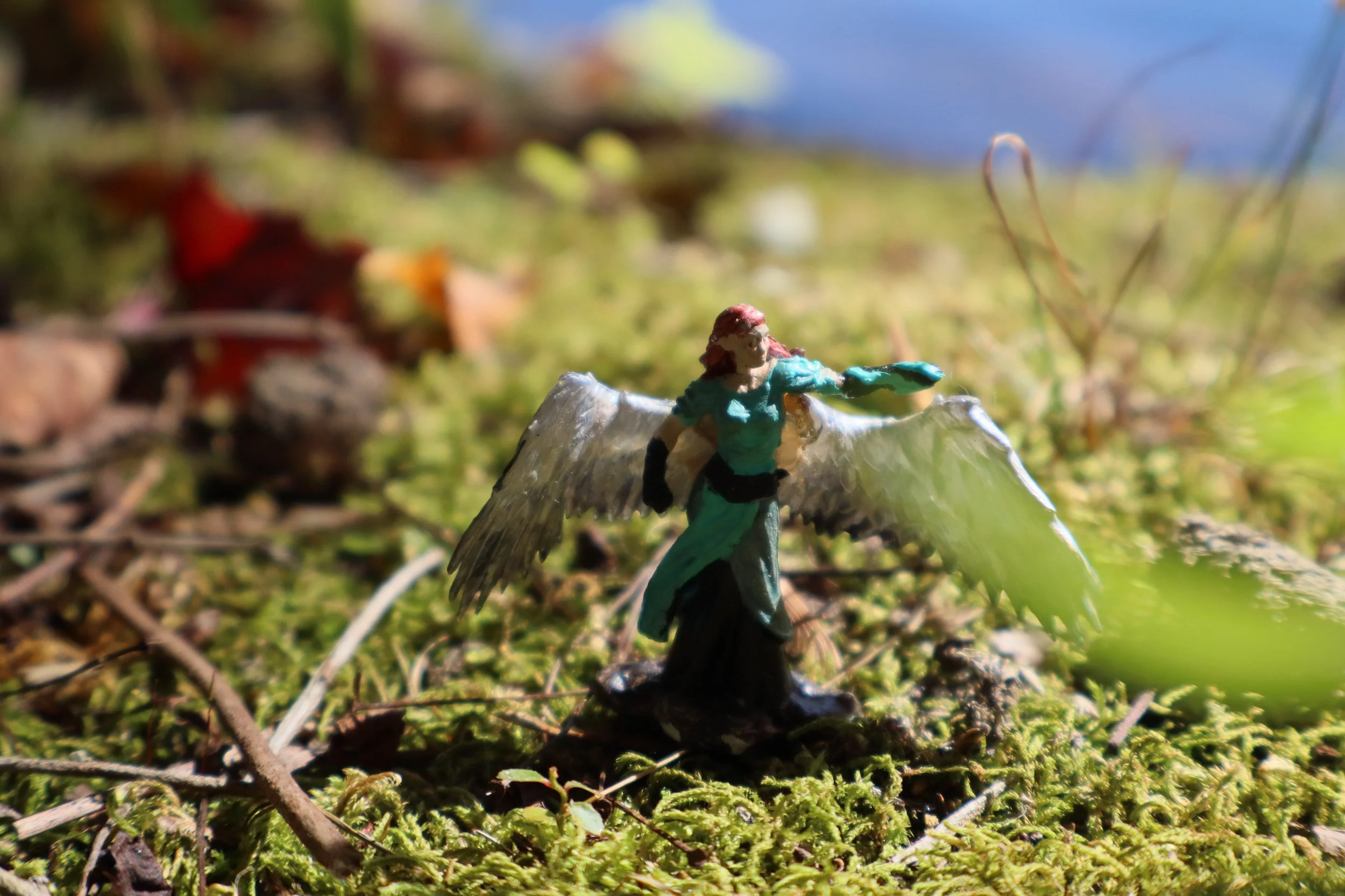 A necromancer elf with rotting angel wings.