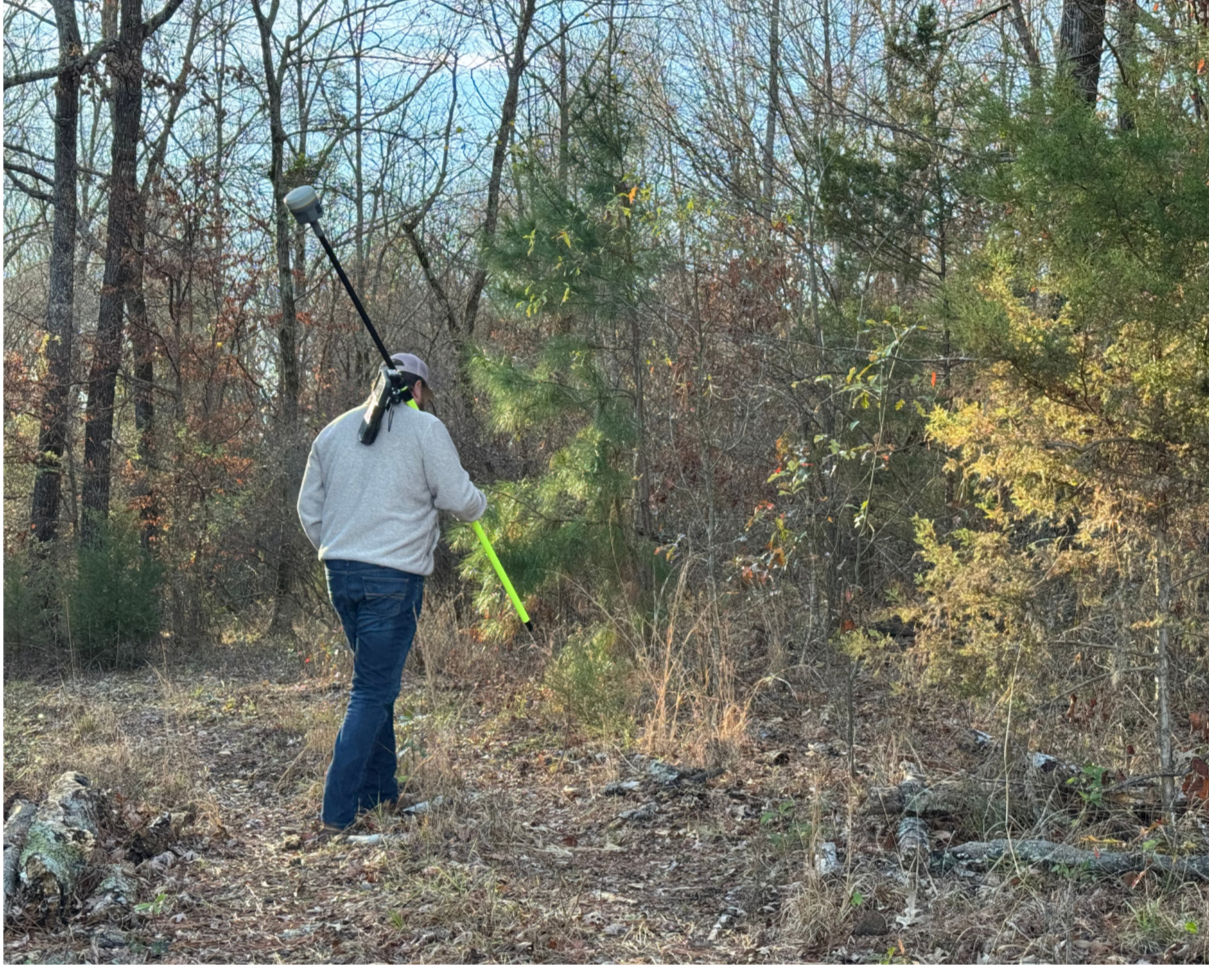 Land Surveyor in the woods