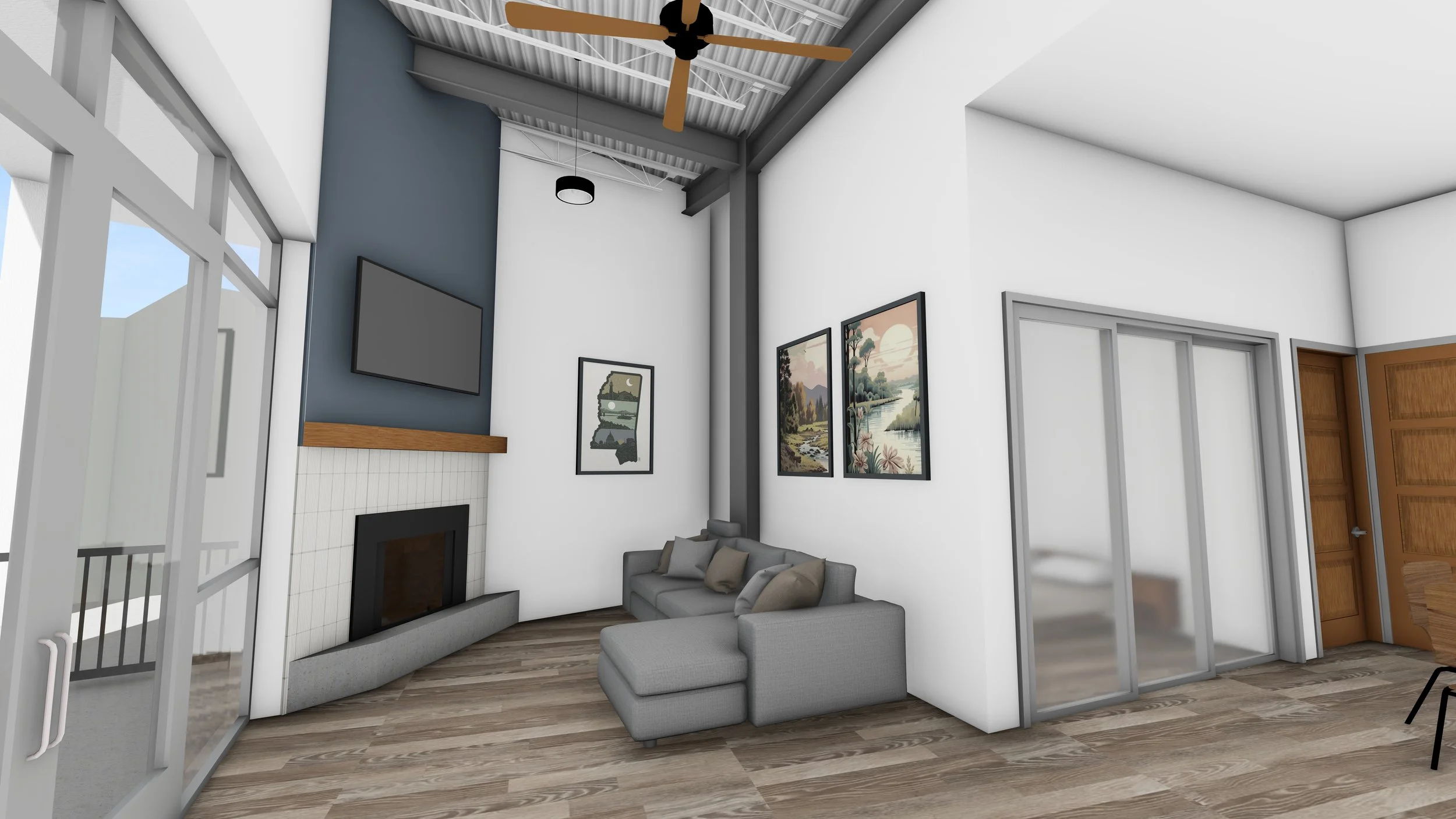 Modern living room with a gray L-shaped sofa, artwork on white walls, a flat-screen TV mounted above a white tiled fireplace, a ceiling fan, and hardwood floors.