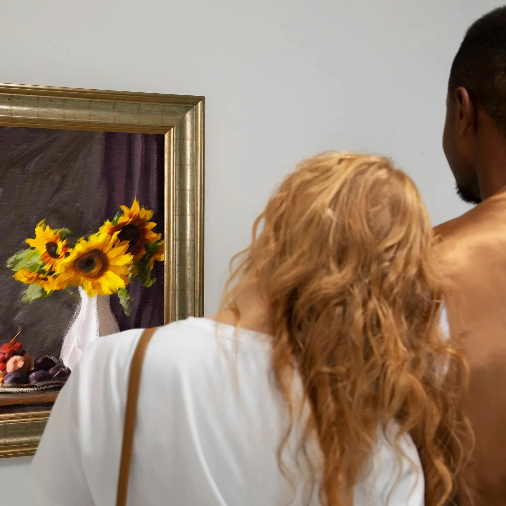 couple-looking-painting-back-view.jpg