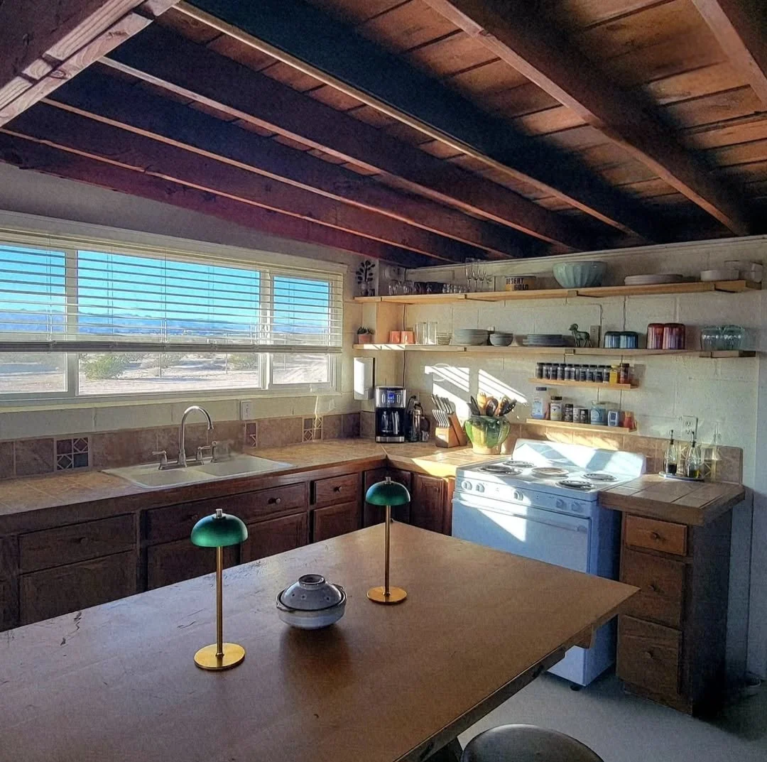 Kitchen interior at Kit Fox Cabin with natural light and desert views in a high desert retreat near Joshua Tree