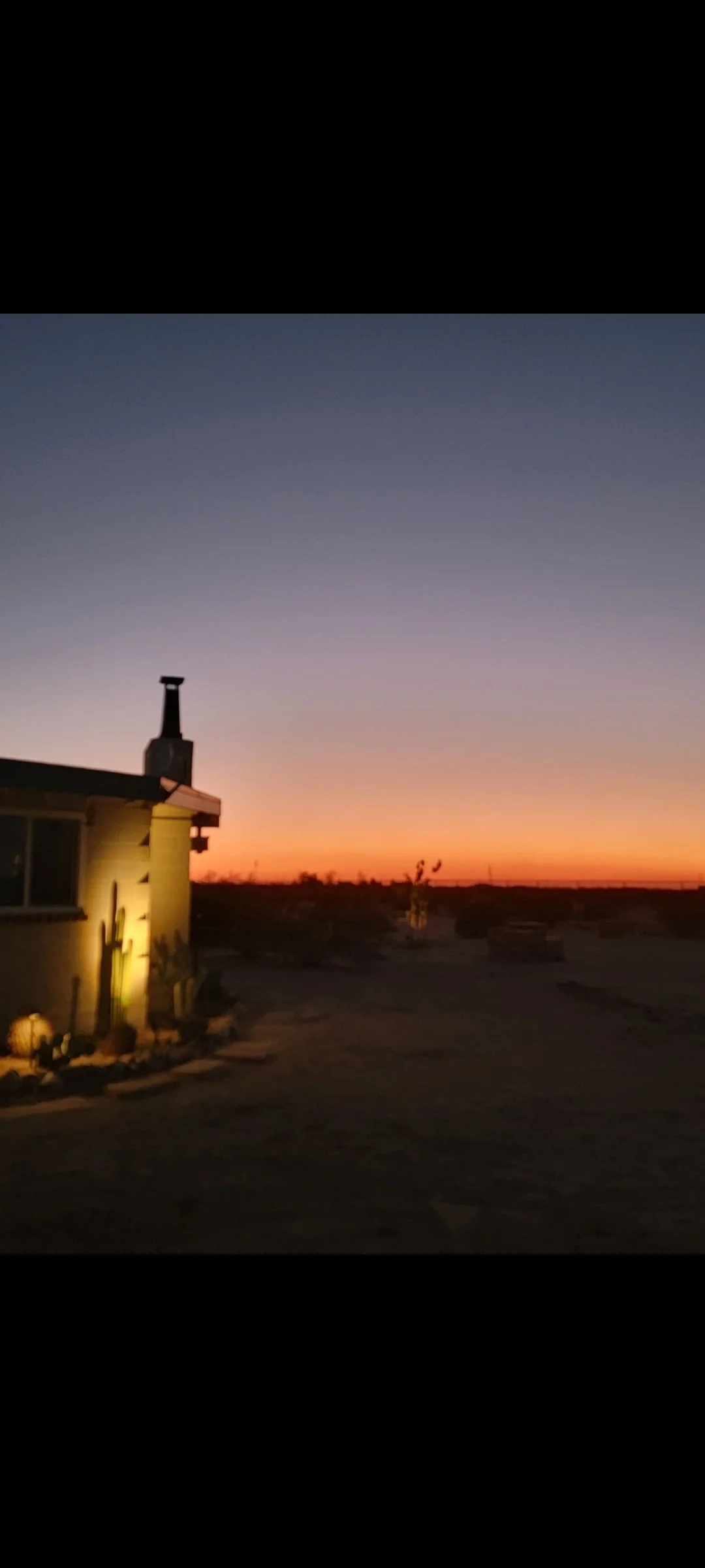 Sunset view of Kit Fox Cabin in the high desert near Joshua Tree National Park