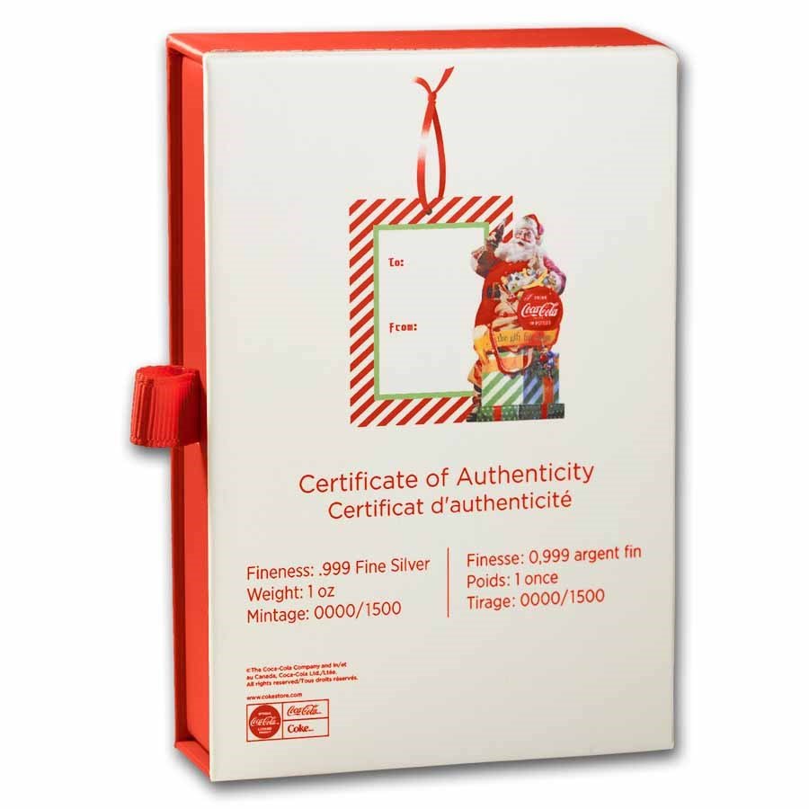 A Coca-Cola themed gift box shaped like a certificate of authenticity for a silver coin, featuring a Christmas design with Santa Claus and a gift, and red and white color accents.
