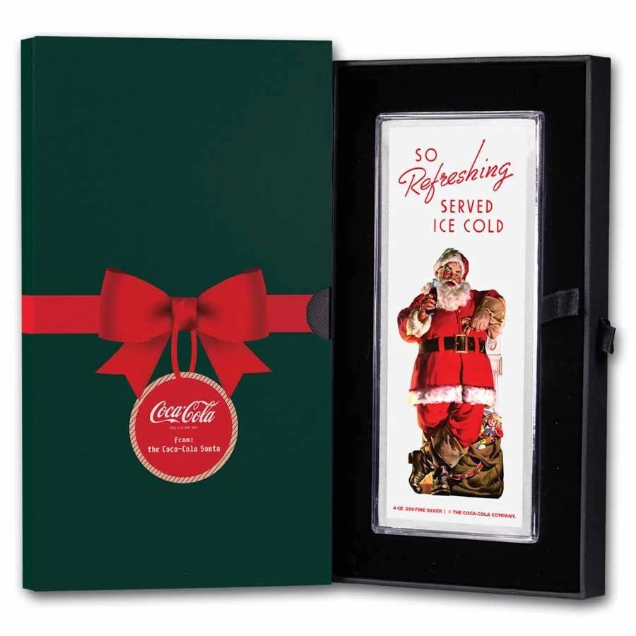 Christmas-themed Coca-Cola gift box featuring a Santa Claus illustration and a silver bar.