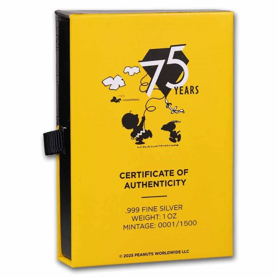 Yellow certificate box with Peanuts characters, celebrating 75 years, with text indicating 999 fine silver, 1 oz weight, and serial number 0001/1500.