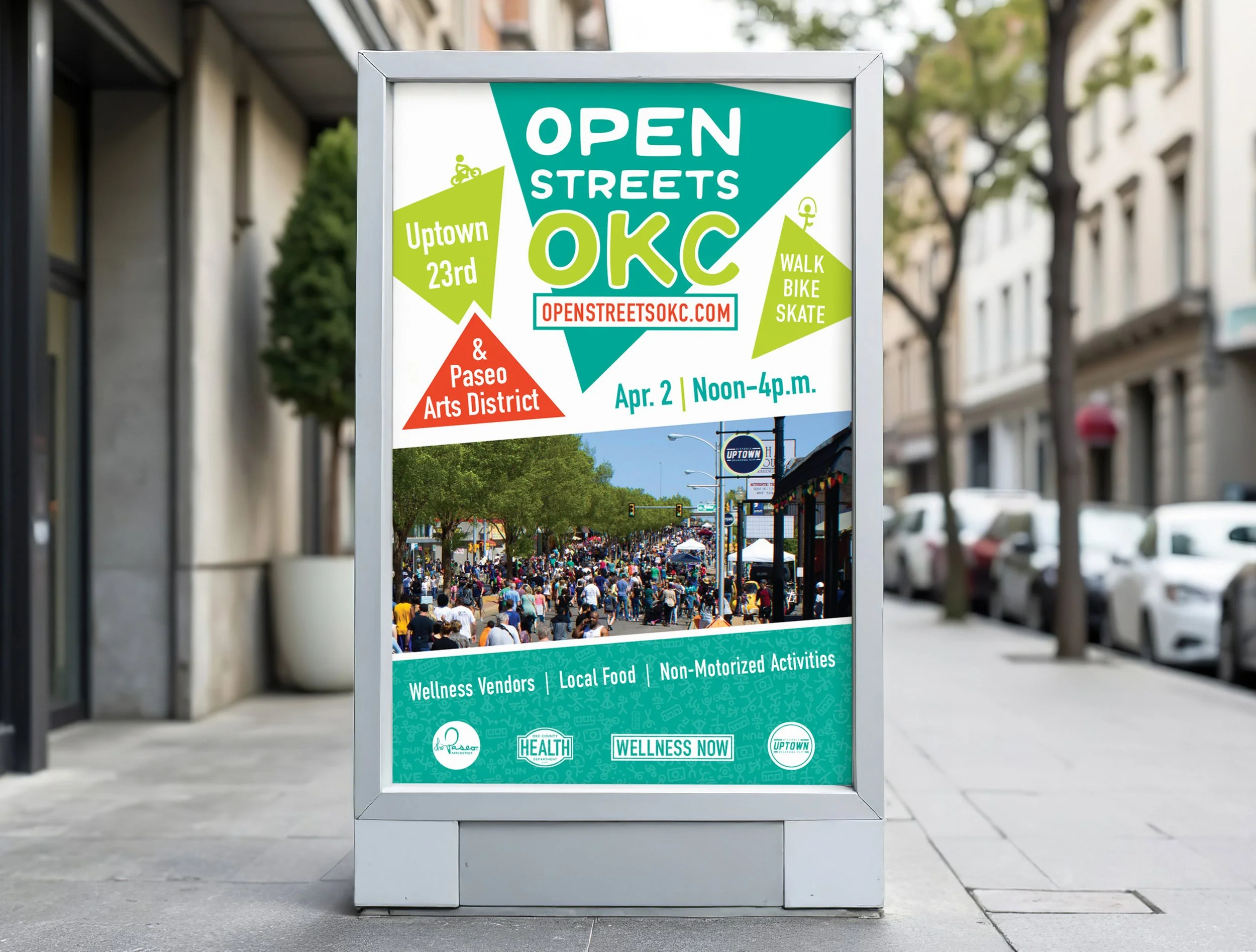 Poster advertising an outdoor event called Open Streets OKC on April 2 from noon to 4 p.m., featuring wellness vendors, local food, and non-motorized activities; includes a photo of a busy street fair with many people, trees, and vendor booths.