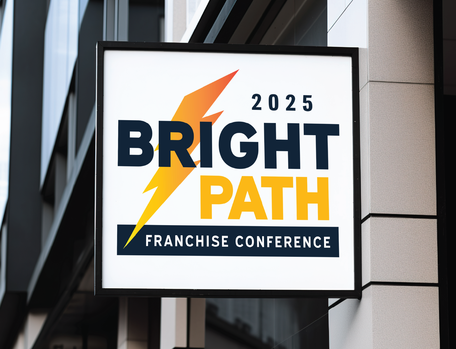 Outdoor sign for the 2025 Bright Path Franchise Conference featuring a yellow lightning bolt and text in black and yellow.