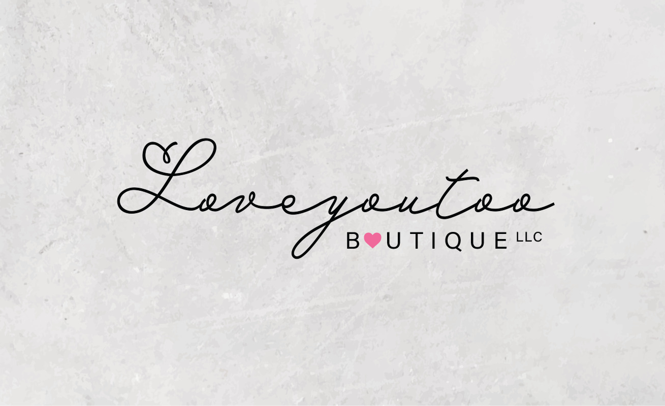 Logo for Love You Too Boutique LLC with elegant cursive font and a pink heart symbol