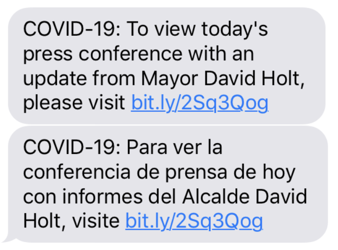 Text message with COVID-19 updates in English and Spanish, including a link to a website for more information.